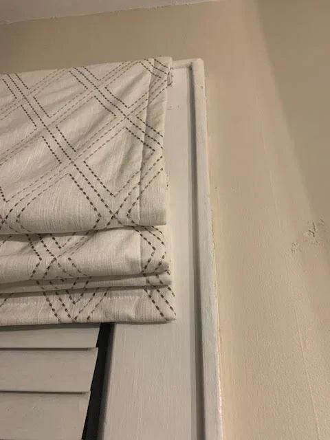 corded roman shades, hiding the cord on a roman shade in a window