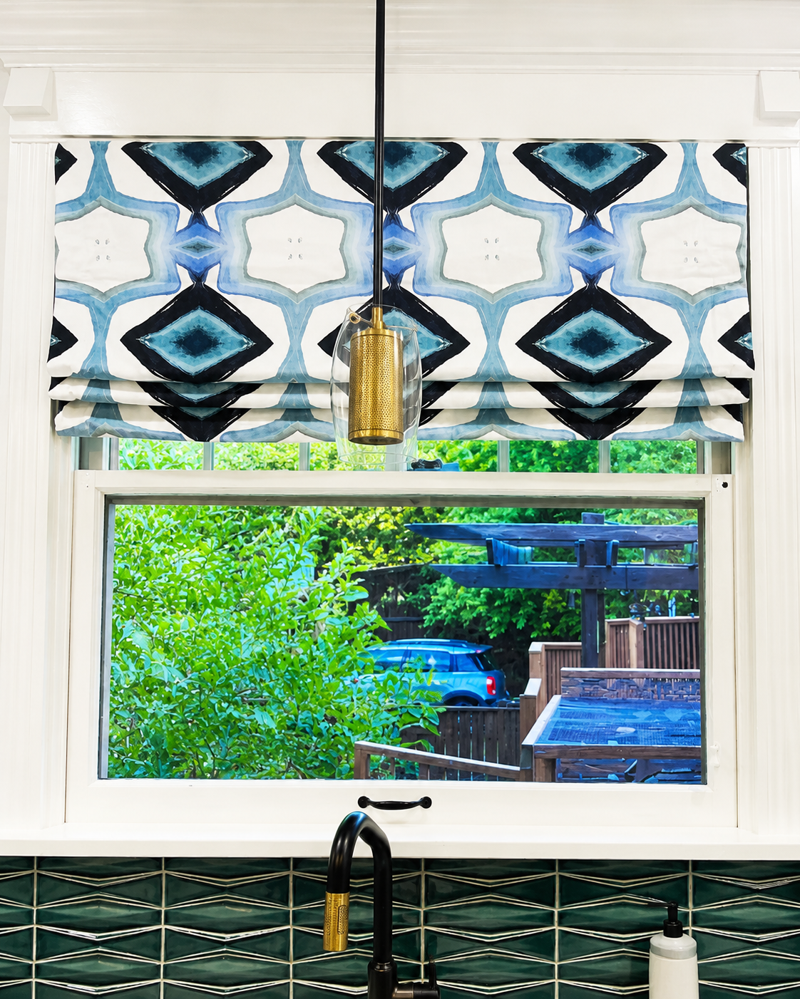 roman shade in a kitchen window