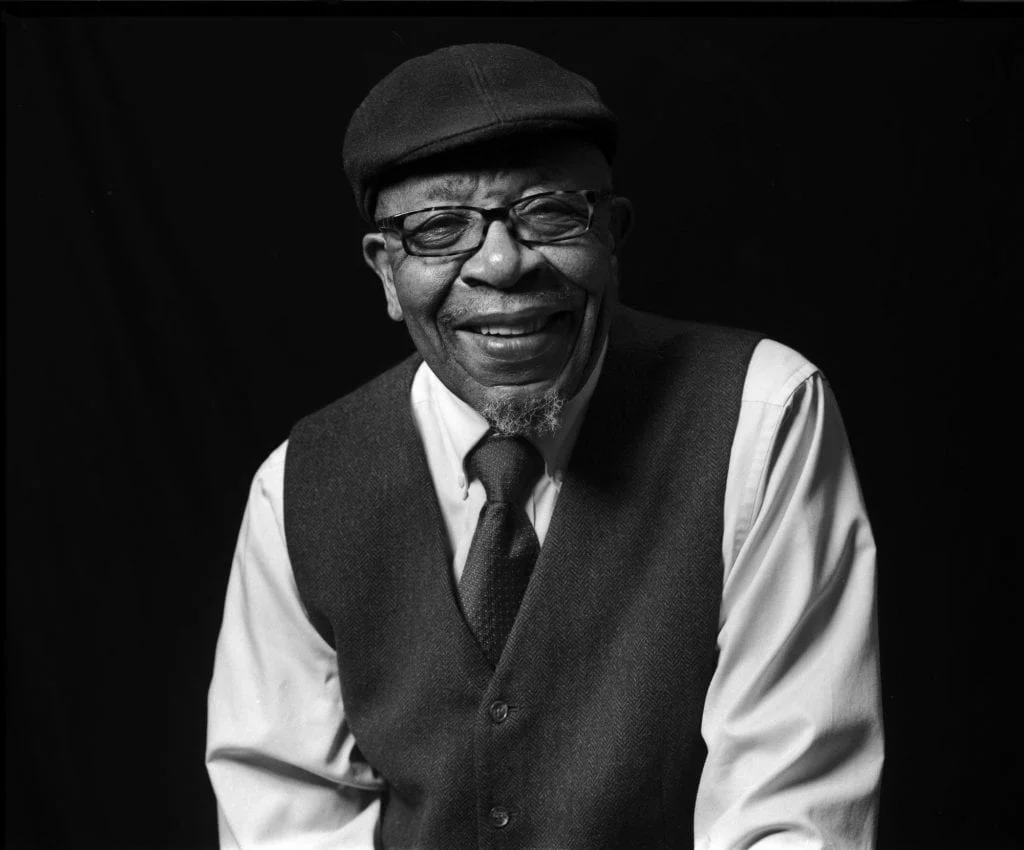 Portrait of John Perkins by Robbie Jeffers .