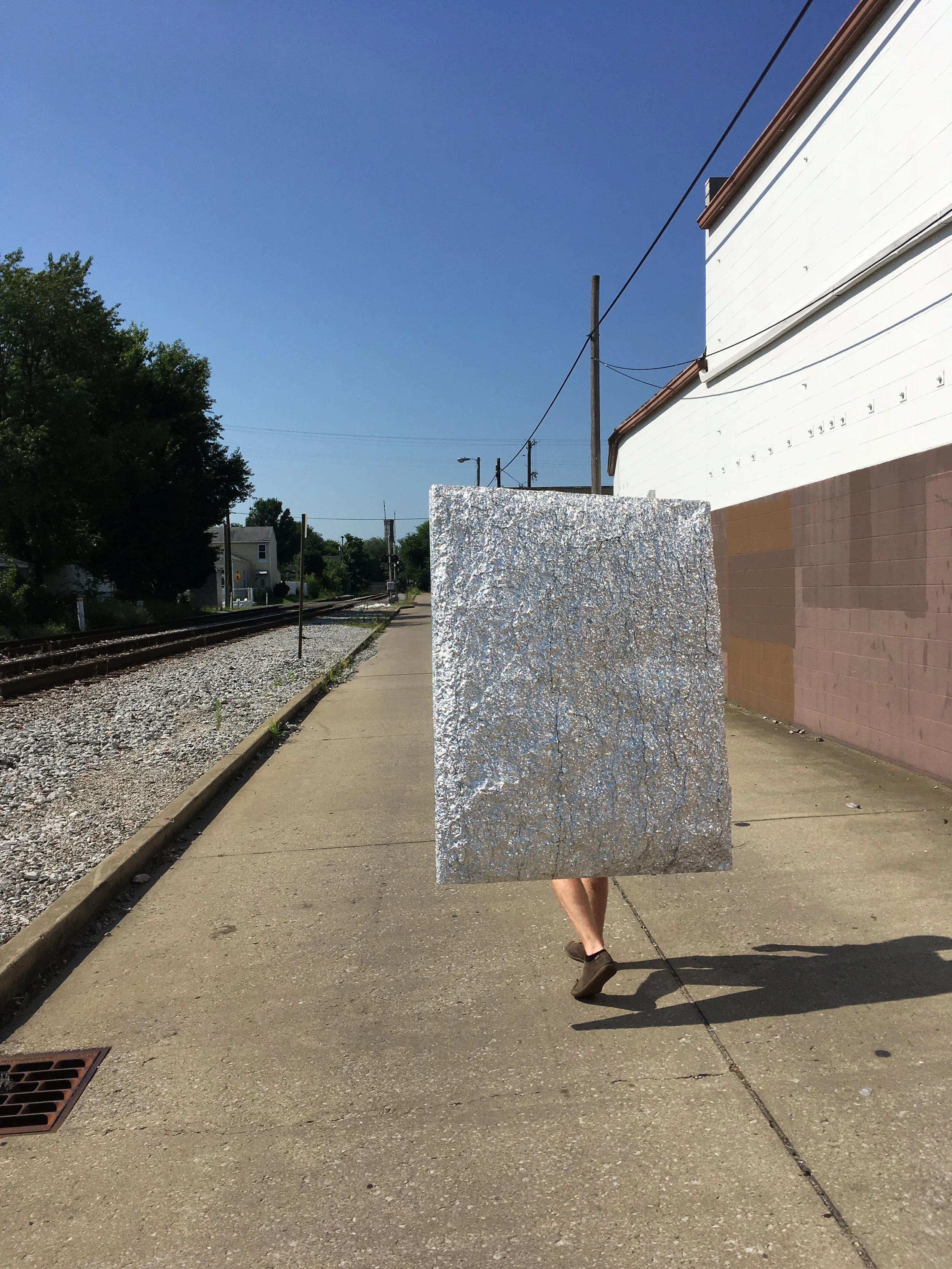 Art by Wayne Adams, from the exhibit Signals and Reflectors , 2013. Photo from 2017, moving the artwork from the 930 building to St. V’s.