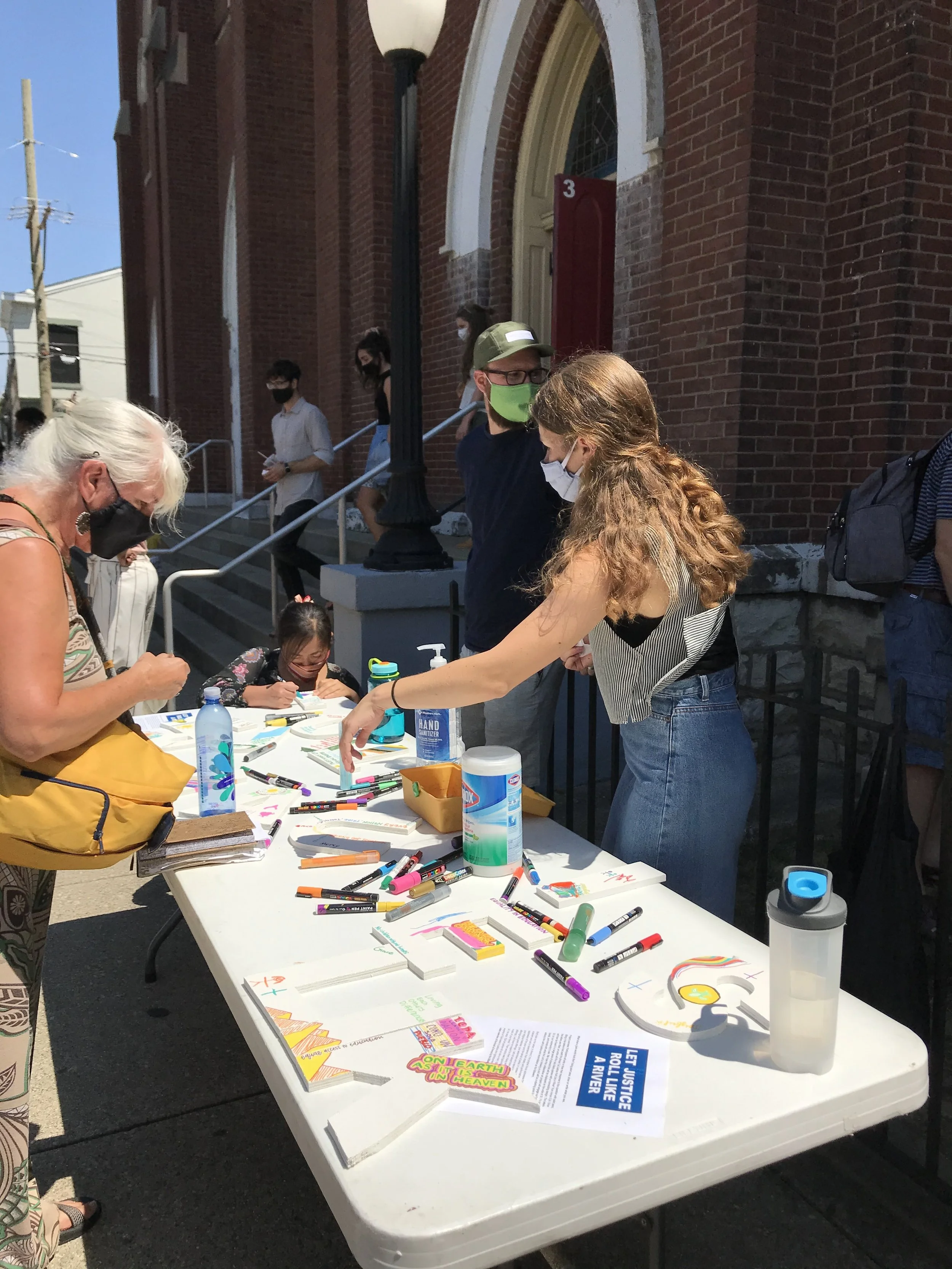 Working on Let Justice Roll , a collaborative art project during the sermon series “ The Gospel, Race, and Justice ”, 2020.