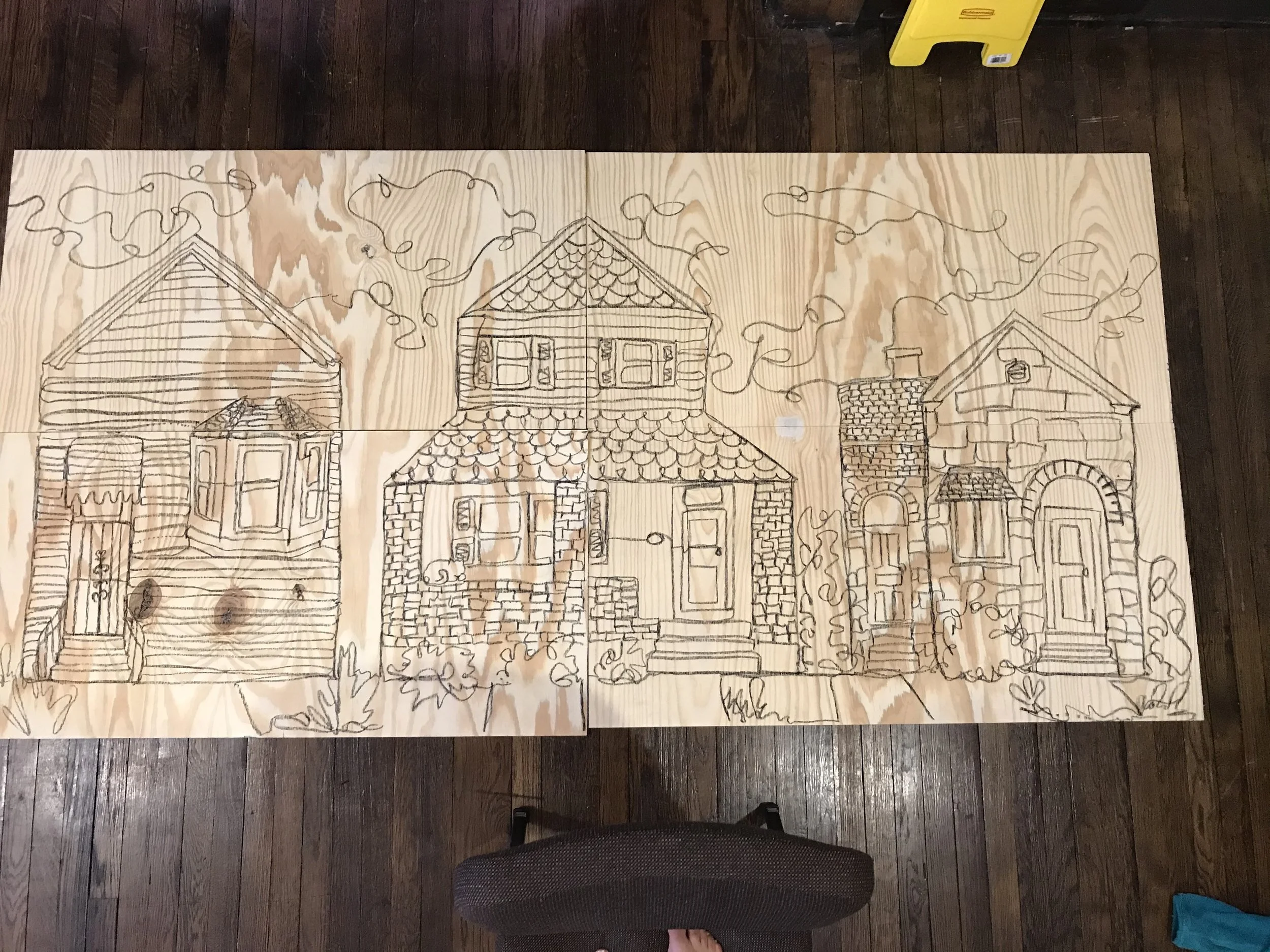  The wood panels with the continuous line drawing of Shelby Park houses on it.   
