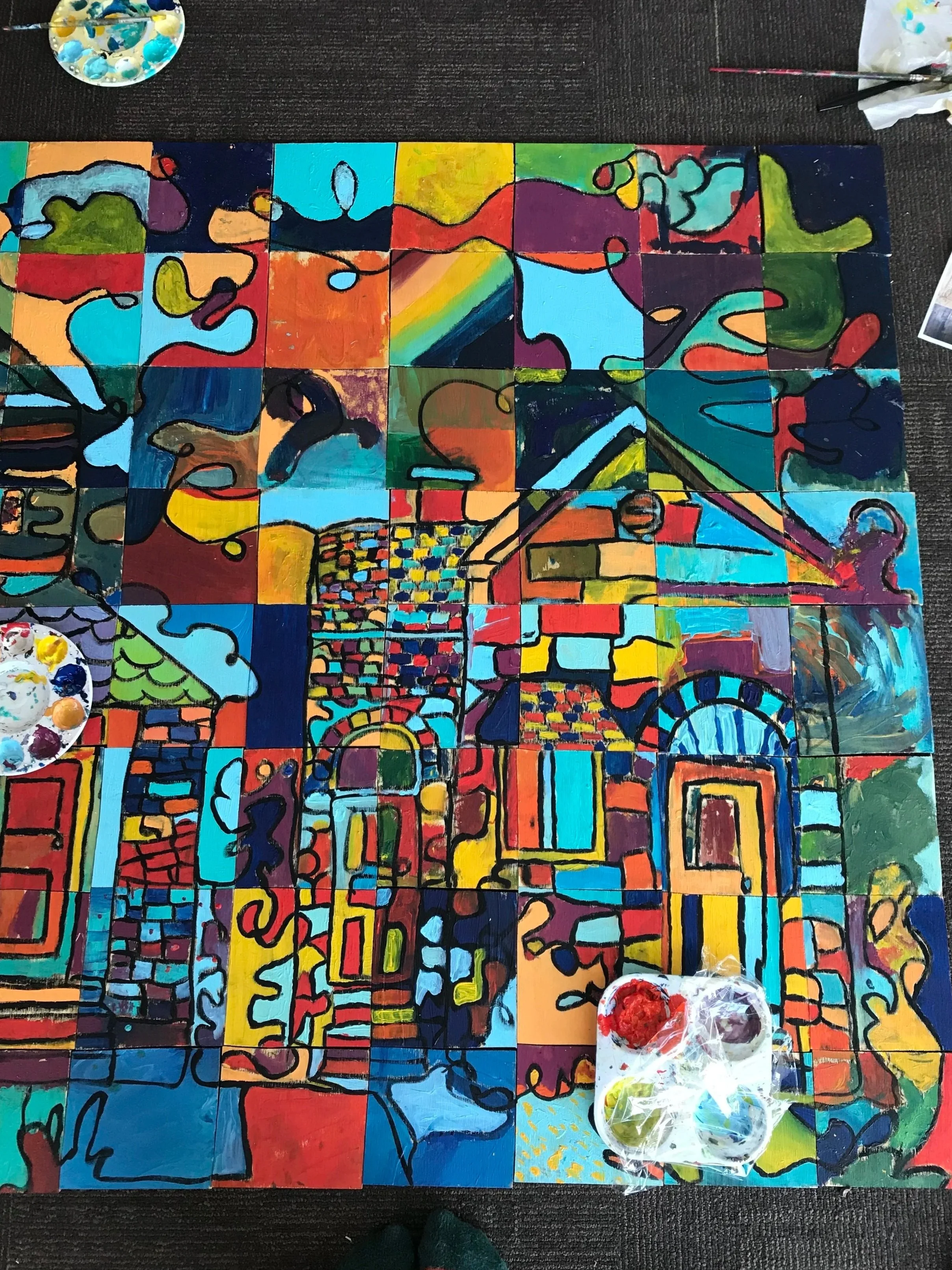  Painting over the original design again with black paint to give the final piece more cohesion.  