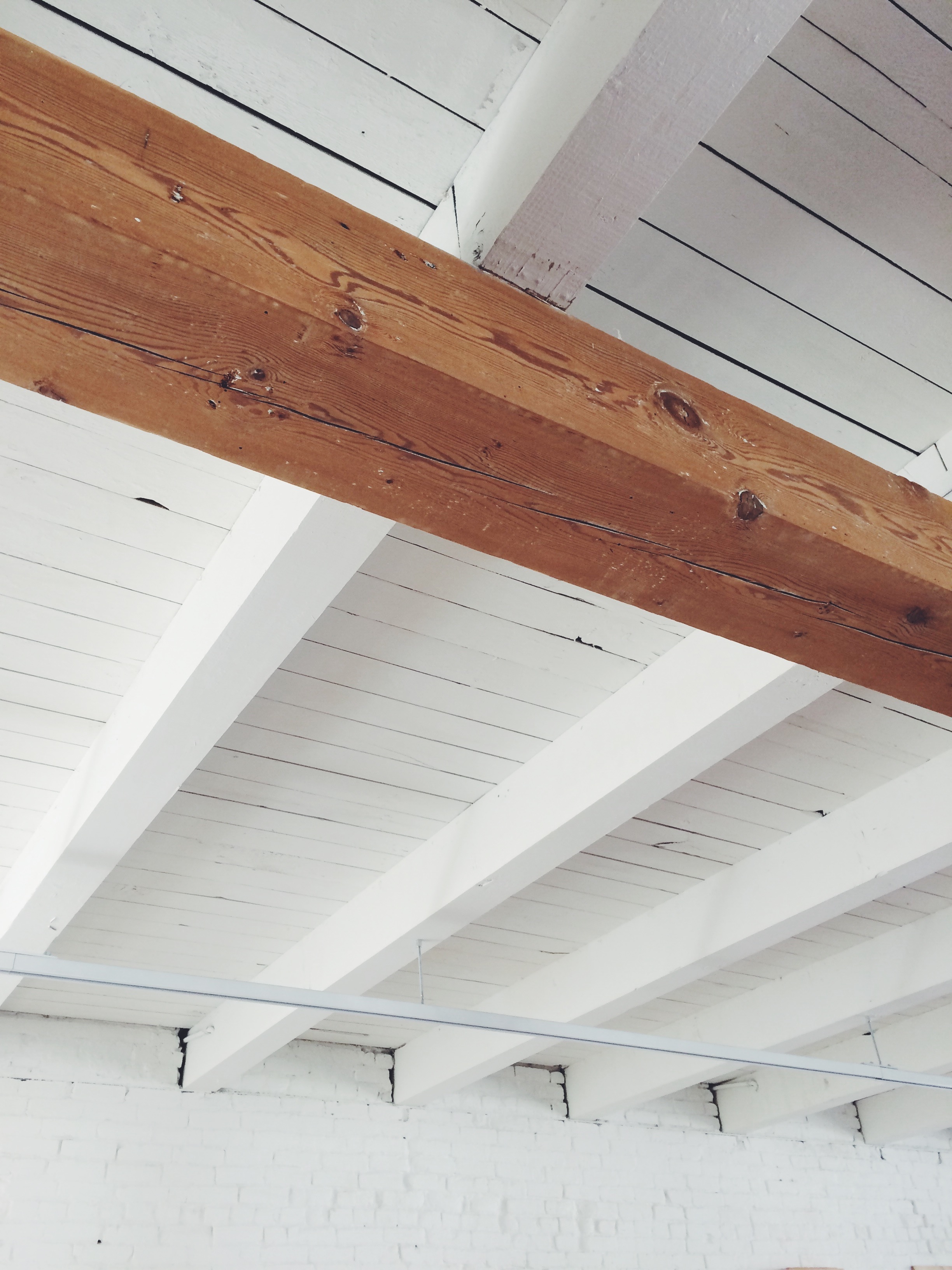 Existing columns and girders were restored to their natural color, while other structure was painted white.