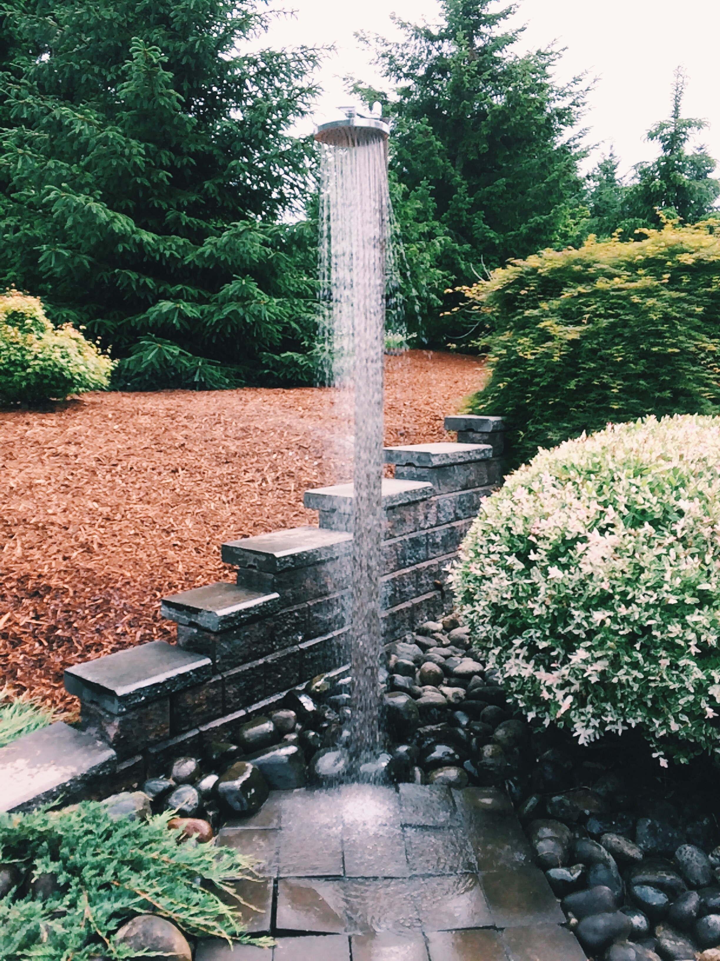 An outdoor shower is used for washing off after recreational activities or yard work.