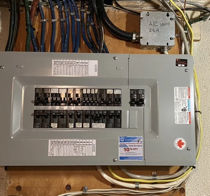 A new electrical panel with circuit breakers was installed to replace the old fuses panel.