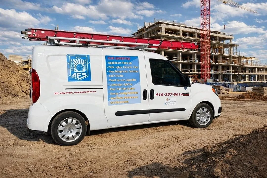 All Electrical Service branded van parked at a large construction site for commercial electrical projects.