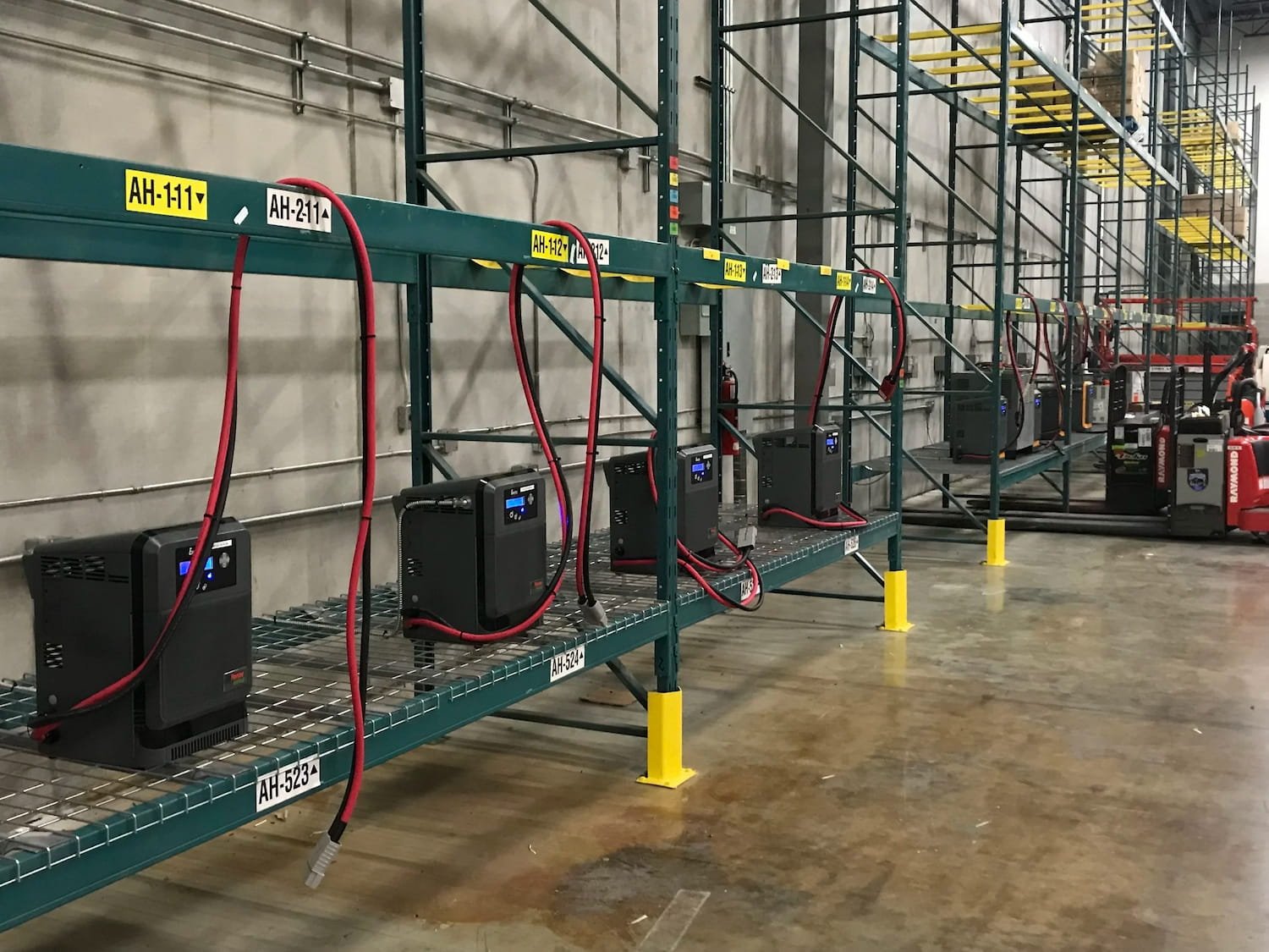 Commercial industrial electrical equipment installed on heavy-duty warehouse shelving by All Electrical Service.