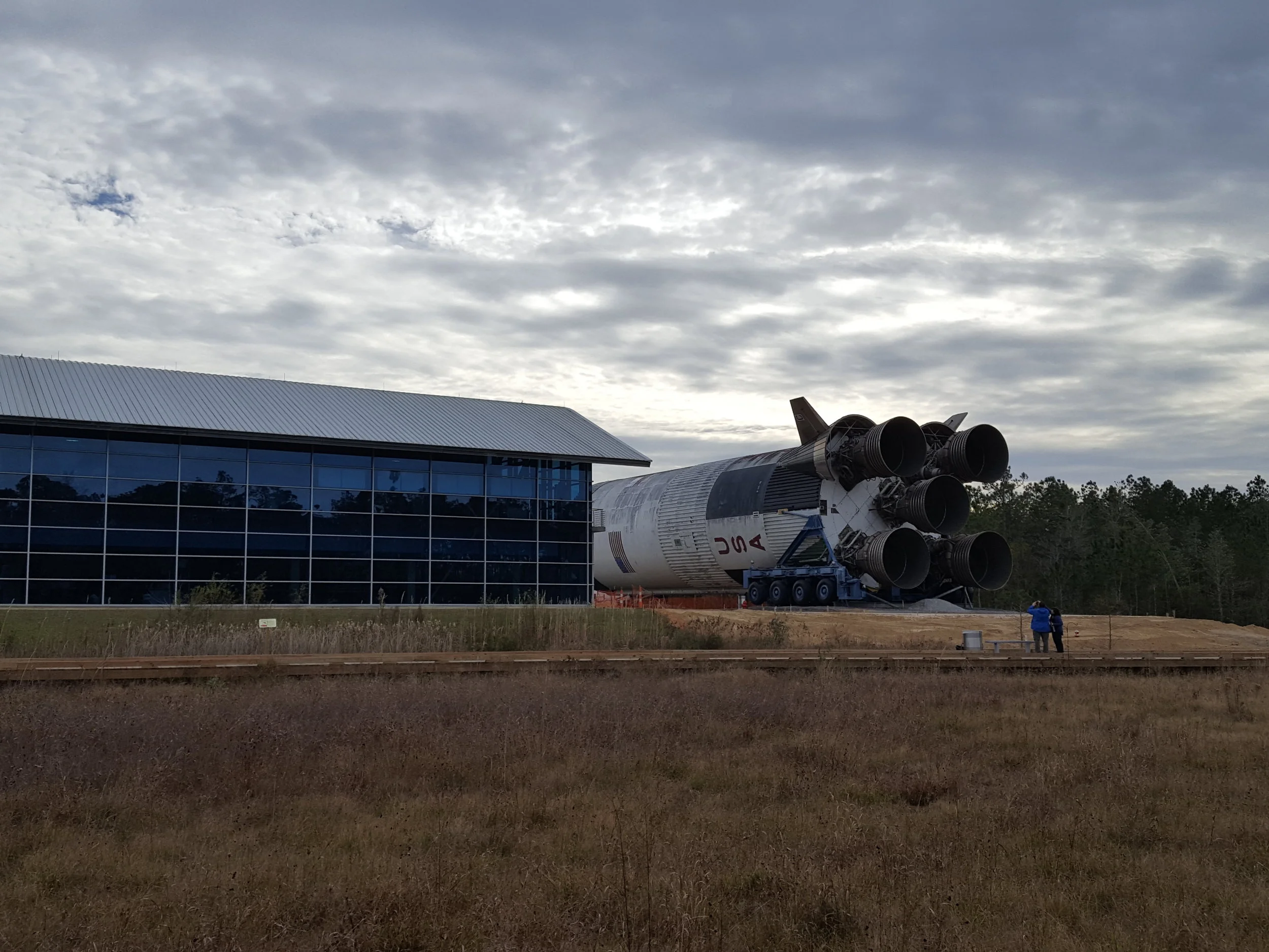First stage of a Saturn V rocket next to the INFINITY Science Center