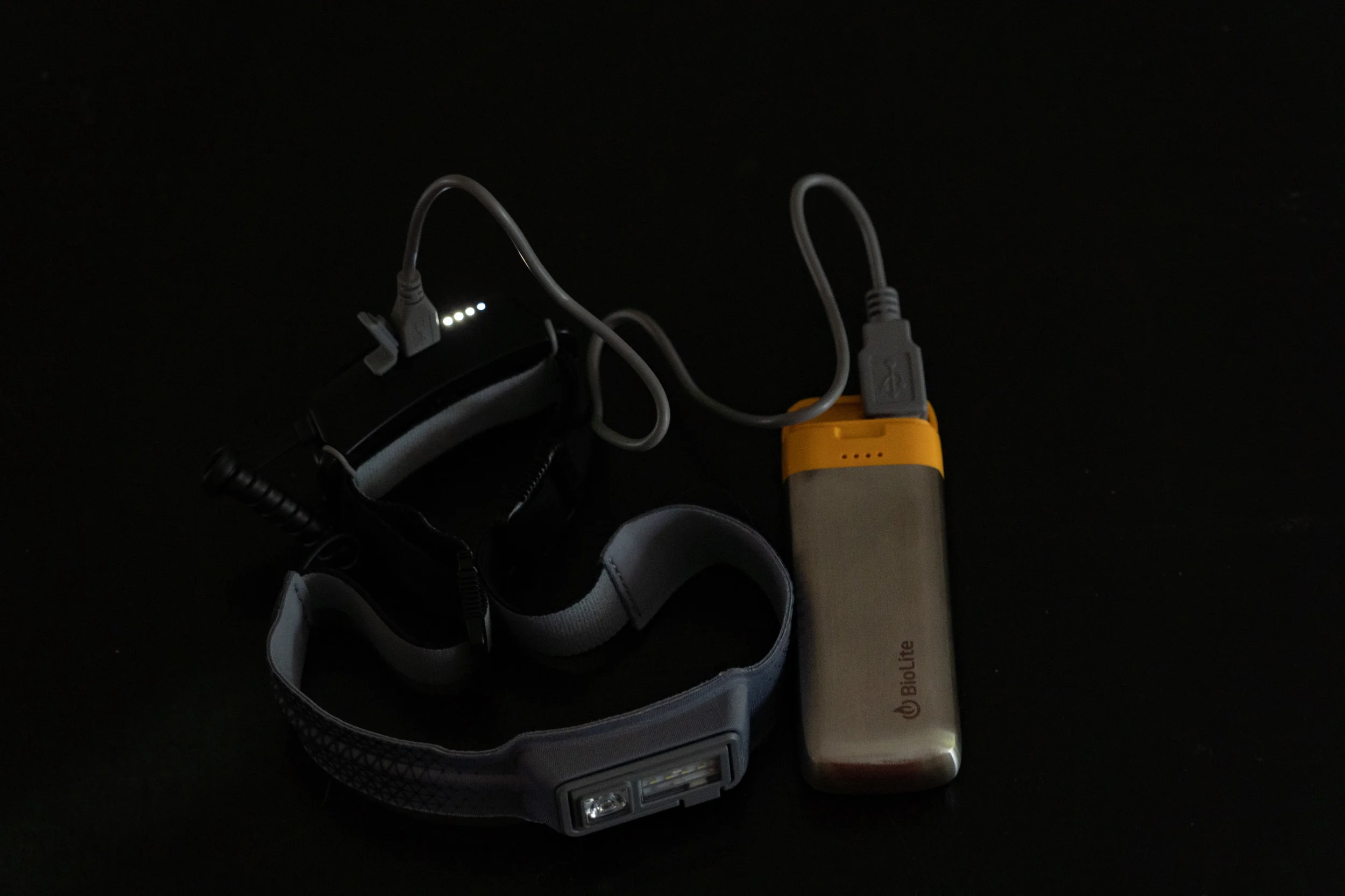 Charge 20 (right) charging the headlamp 330 (left).