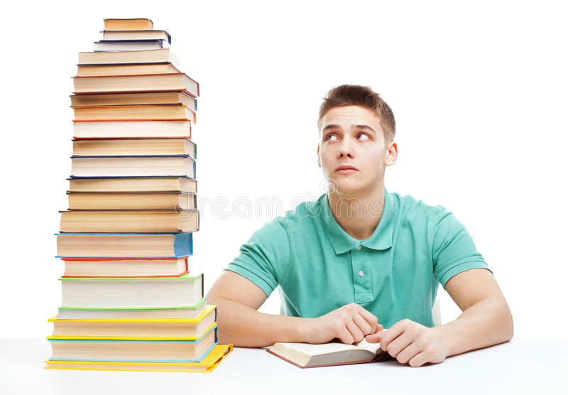 young-frustrated-student-sitting-desk-high-books-sta-stack-isolated-white-background-34742257.jpg