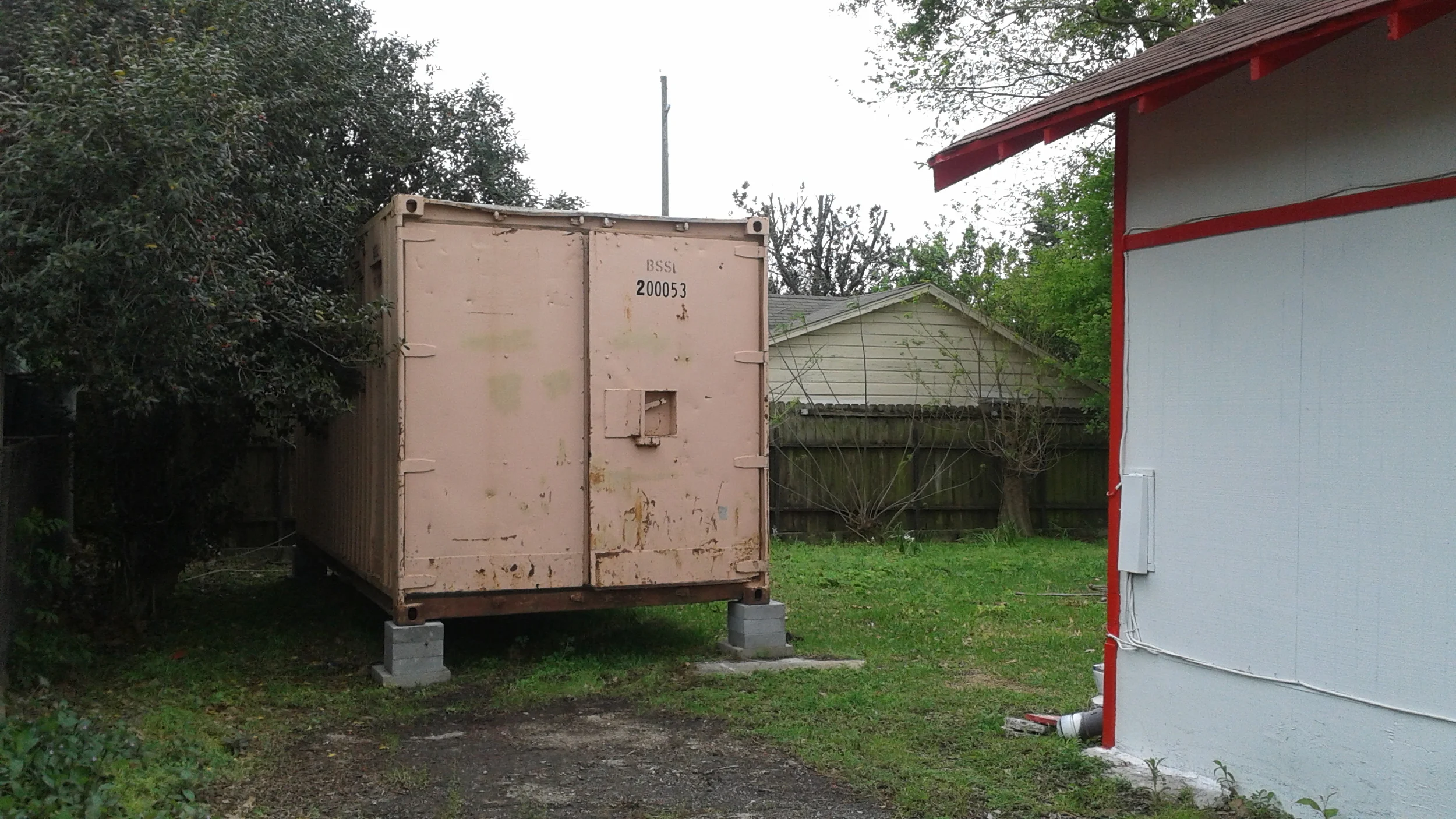 The ISBU container from the driveway of the Sanchez Law Building.