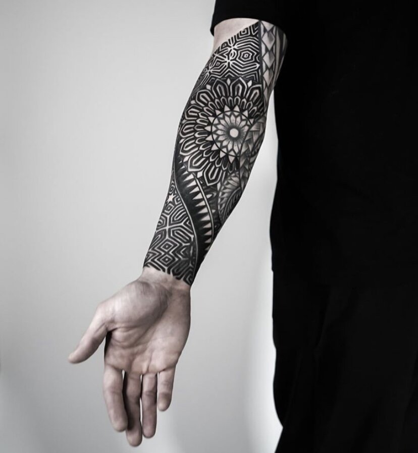 Intricate mandala inspired sleeve tattoo