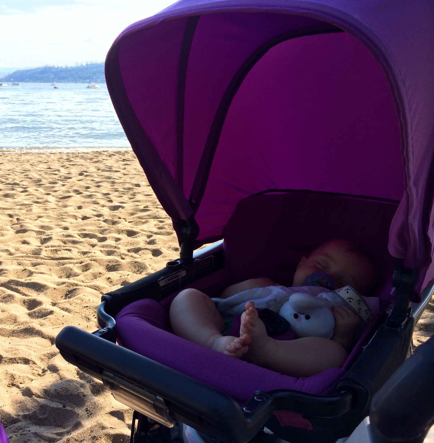 Getting some beauty rest and quiet time at the beach in the AMAZING Orbit Baby Stroller.
