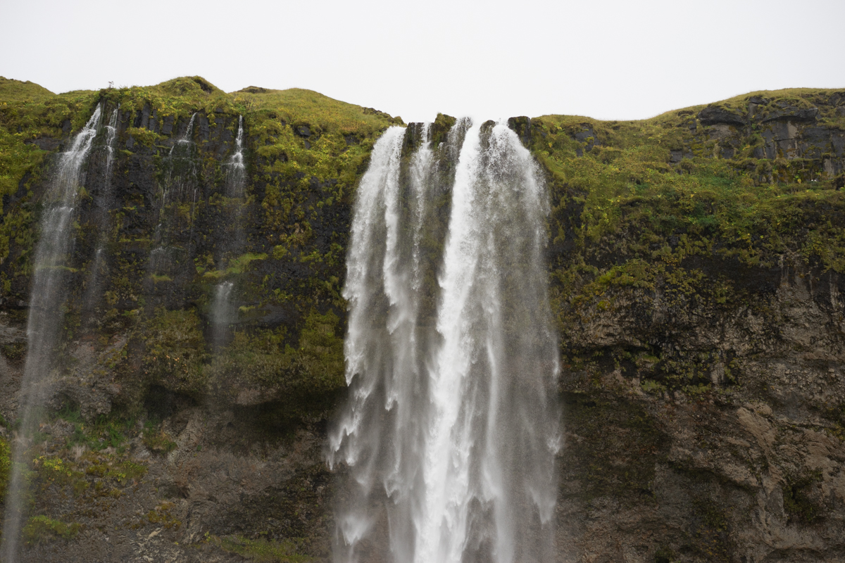 The famous Seljalandsfoss Waterfall... it started raining again once we arrived.