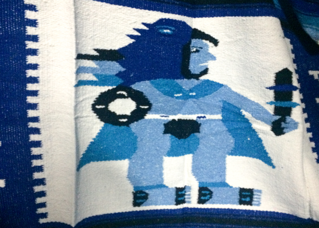 The one shop in Mulegé that sold Mexican blankets was owned by a woman from Oaxaca (famous for it's handmade goods). I bought this extremely bizarre one from her. This warrior will always protect me!