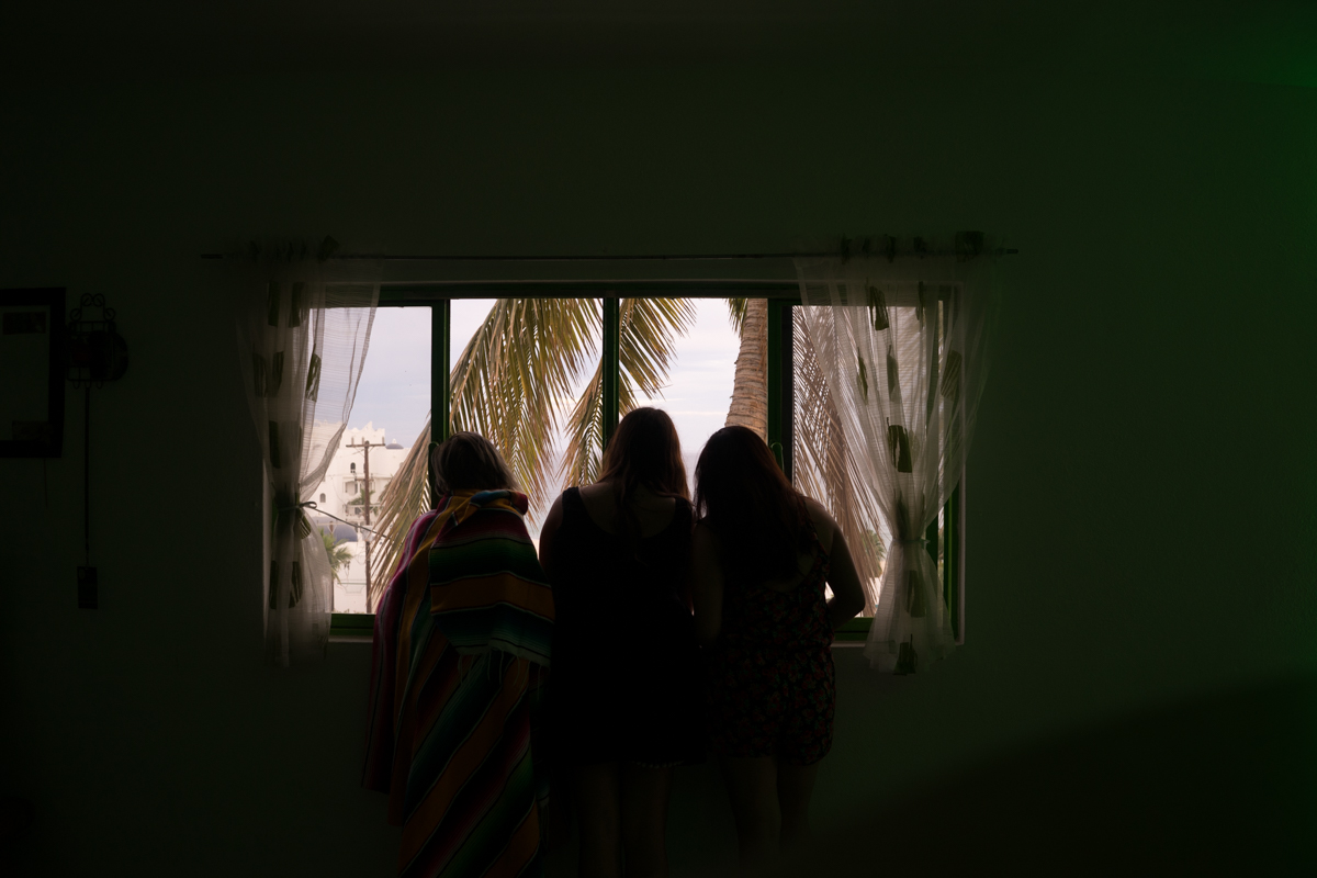 Claudia, Sara, and I gazing out the window at the beach across the street from the hostel in Cabo San Jose.