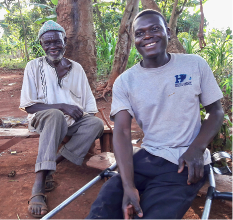 Yunusu at home with his father