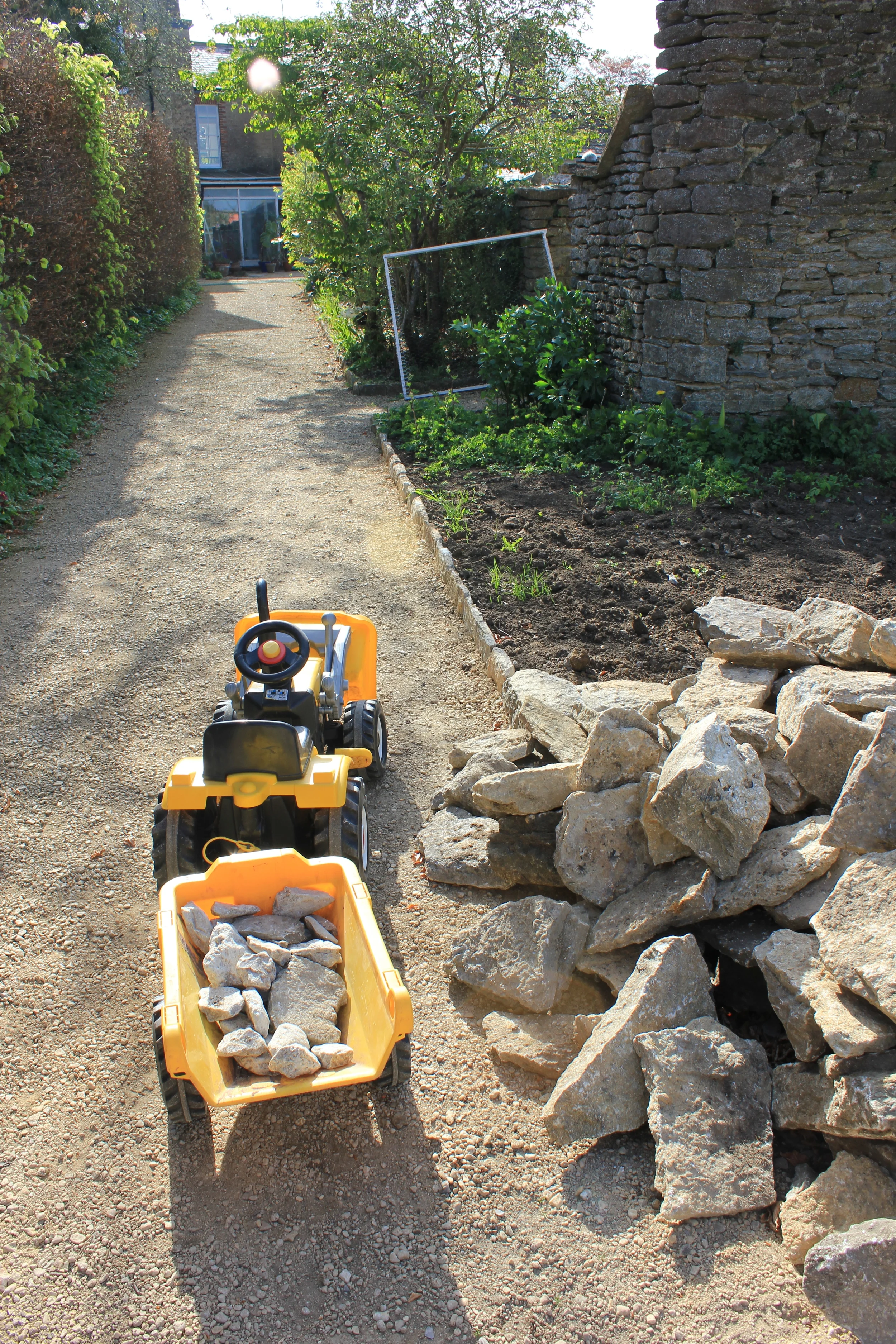 Two small boys fulfilling their dream to work with the construction team