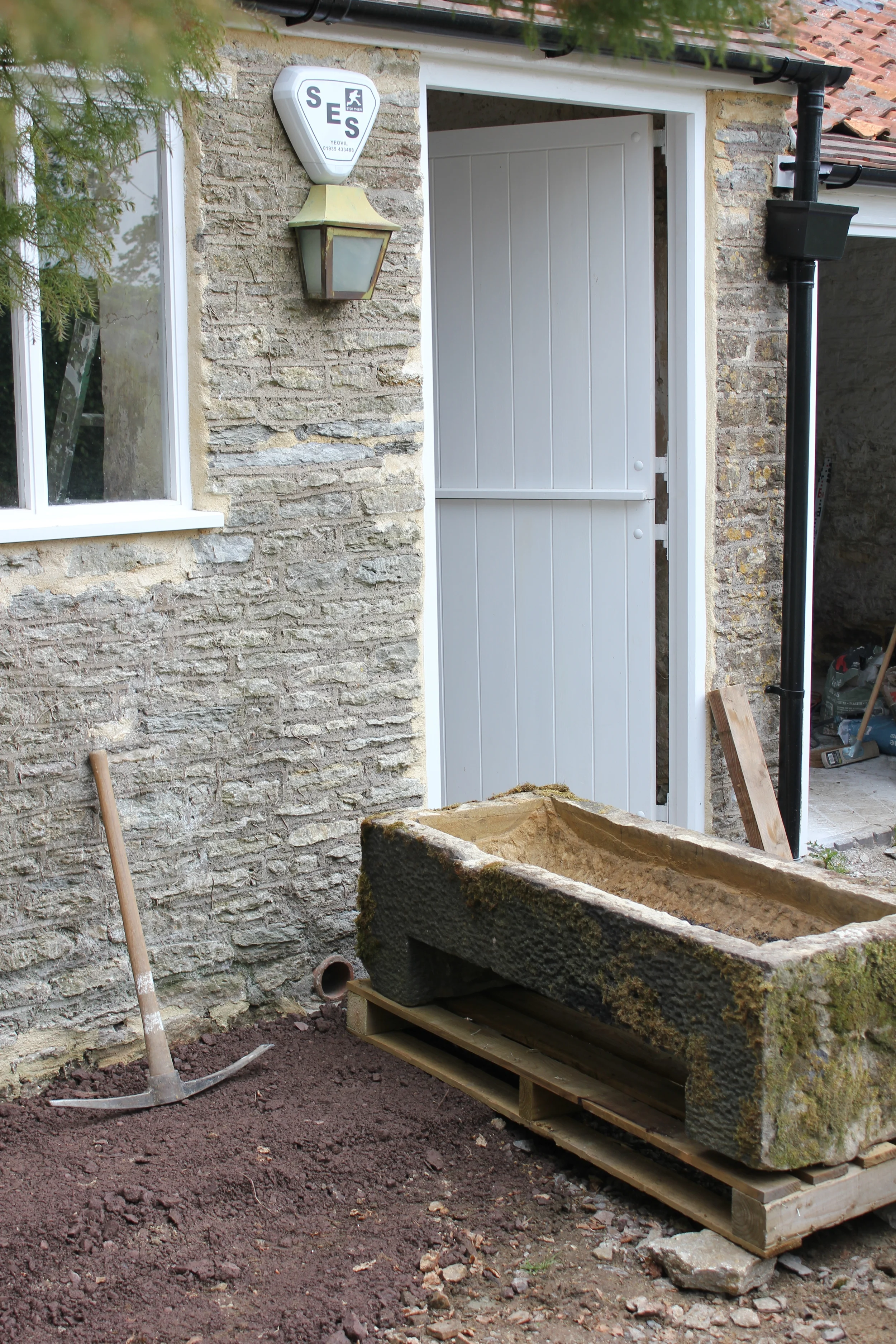 The reclaimed stone trough arrives