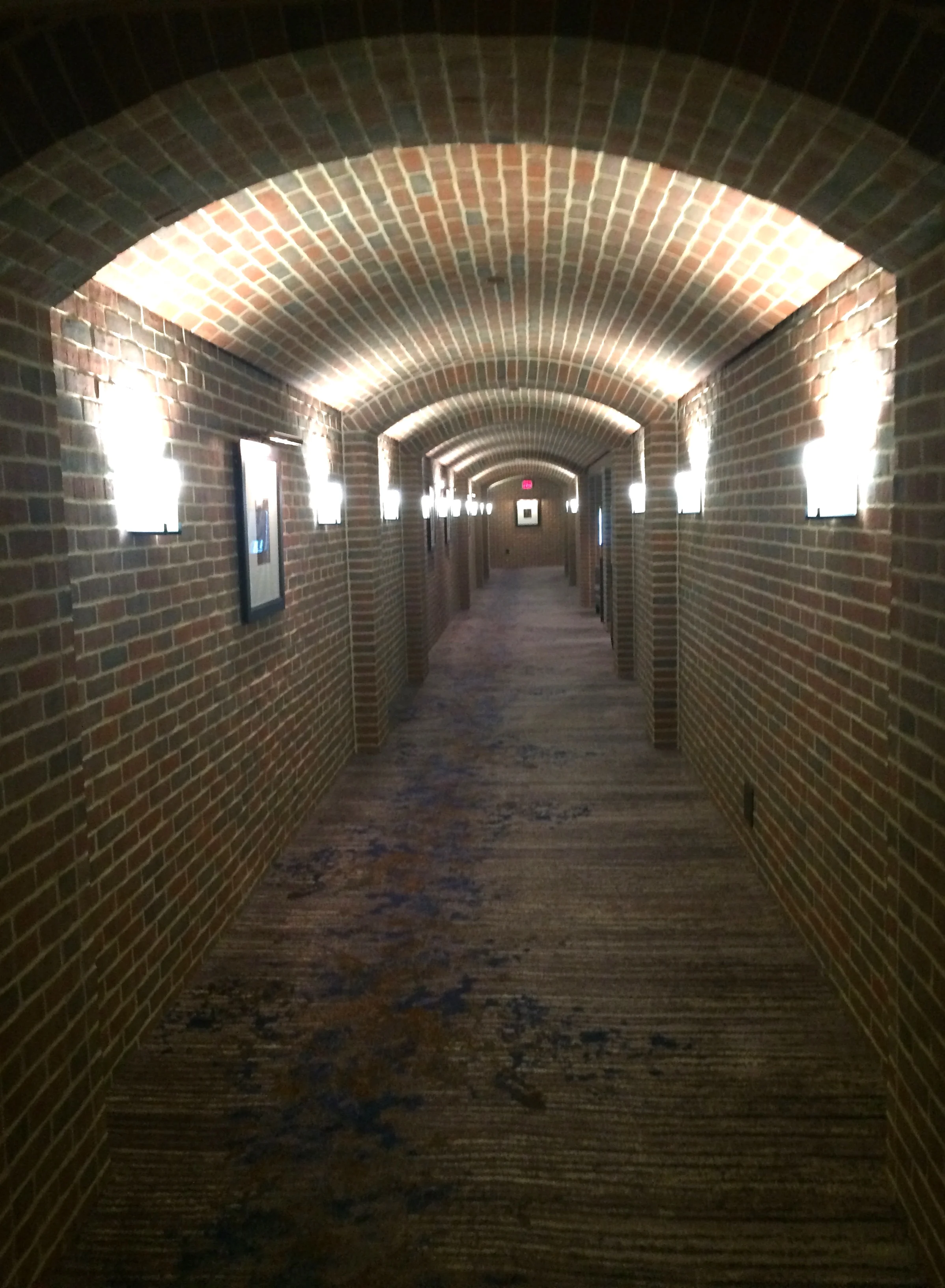 Brick walls line the walk to hotel rooms and meeting areas.