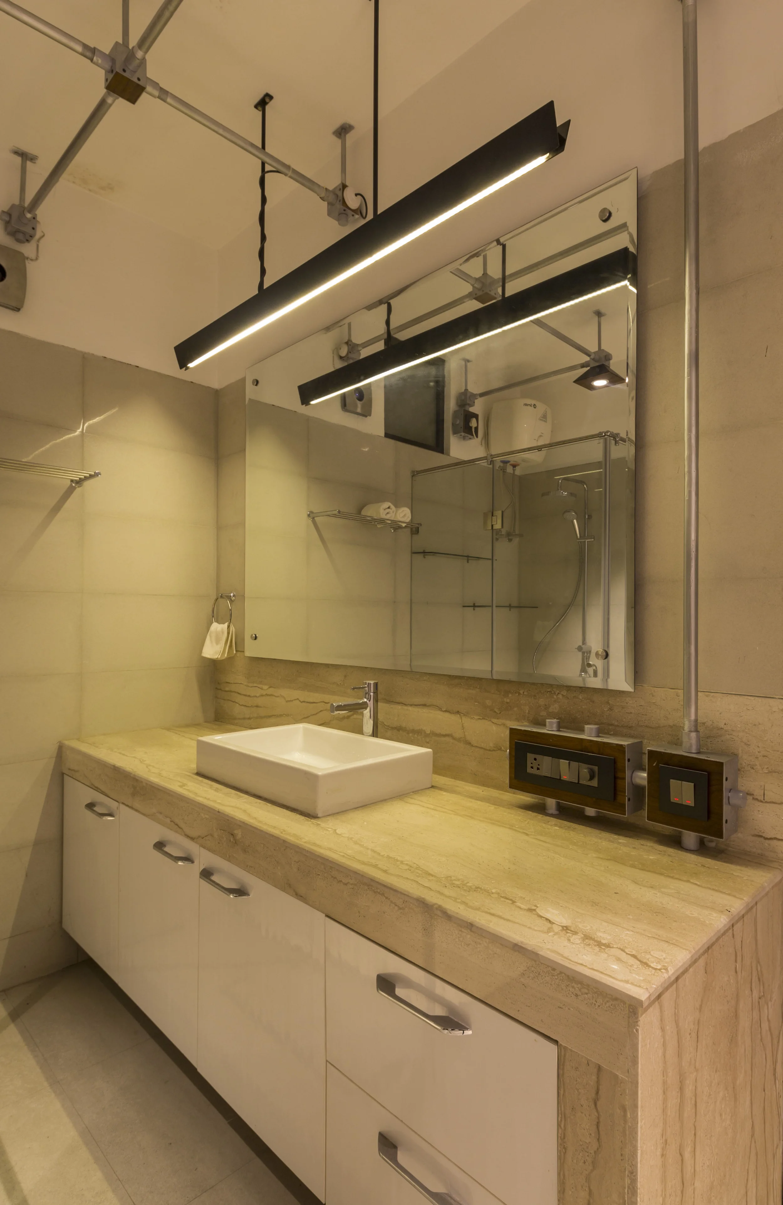 Exposed and detailed electrical system and interfaces, Defense Colony House by Harsh Vardhan Jain Architects. Photography by Nakul Jain
