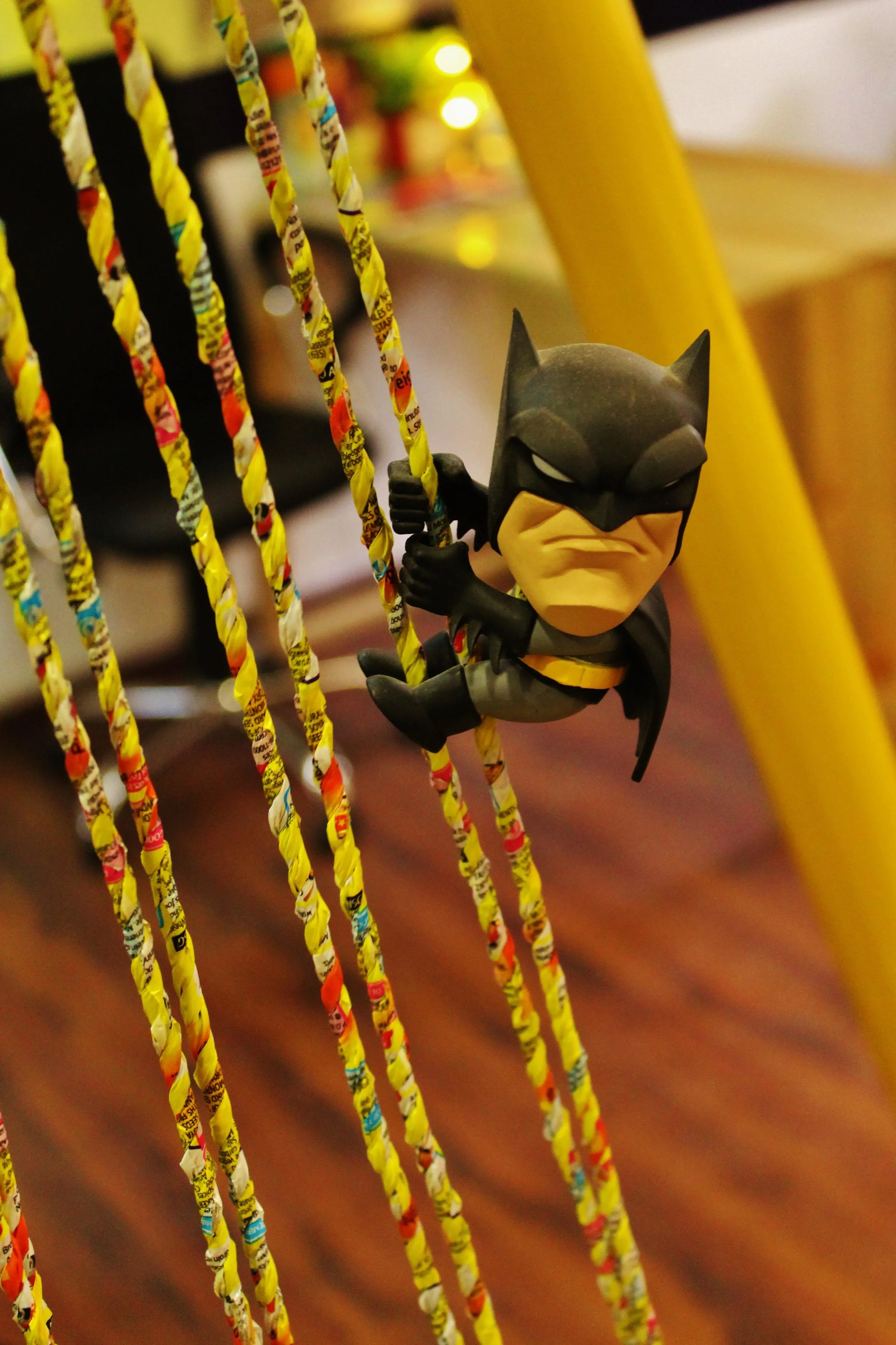 Woven, re-used plastic plastics cover the cables of this swing-set, which also acts as the waiting area for the office.
