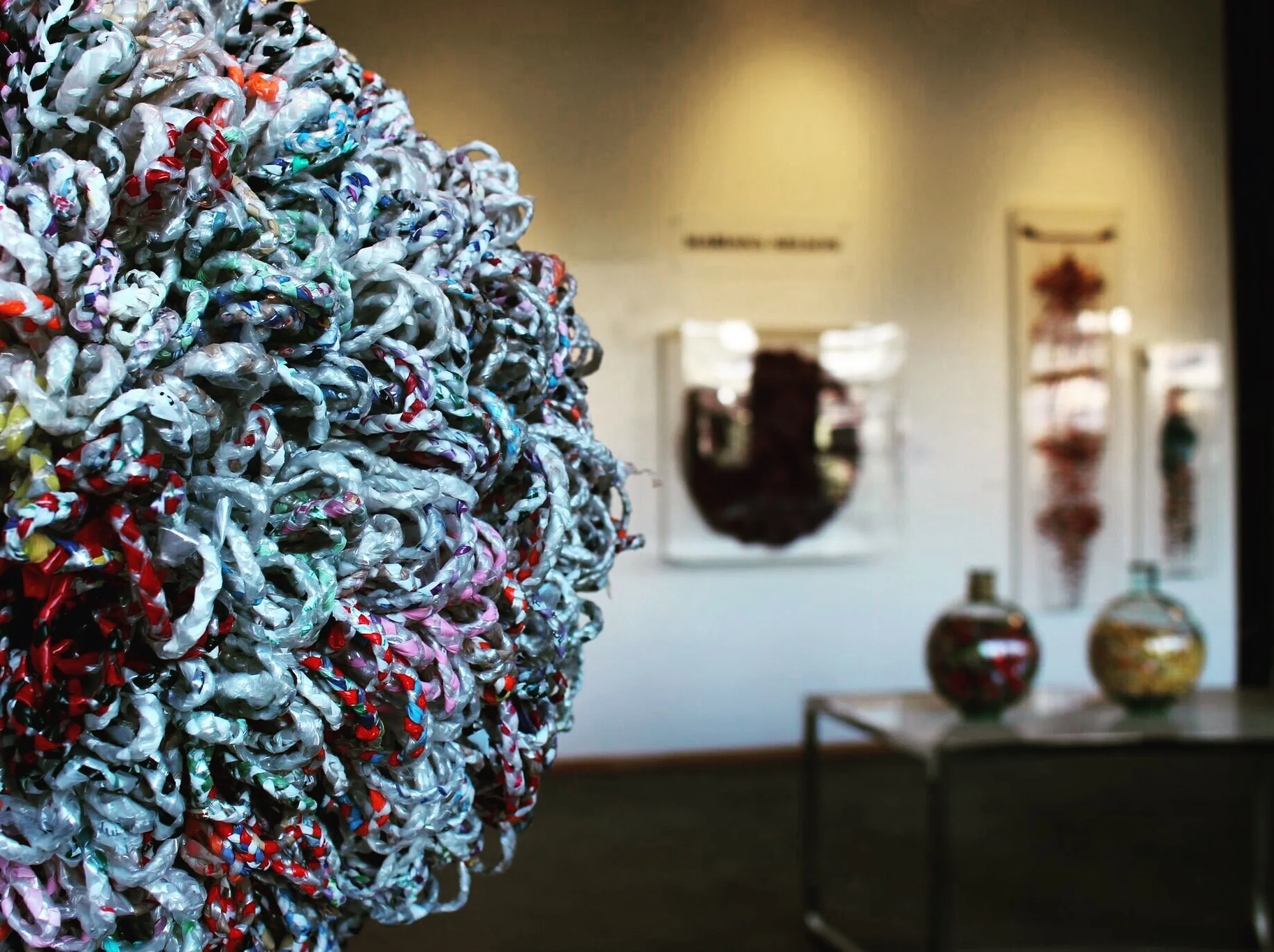 Braiding discarded, recycled material into art, by Mariana Nelson.