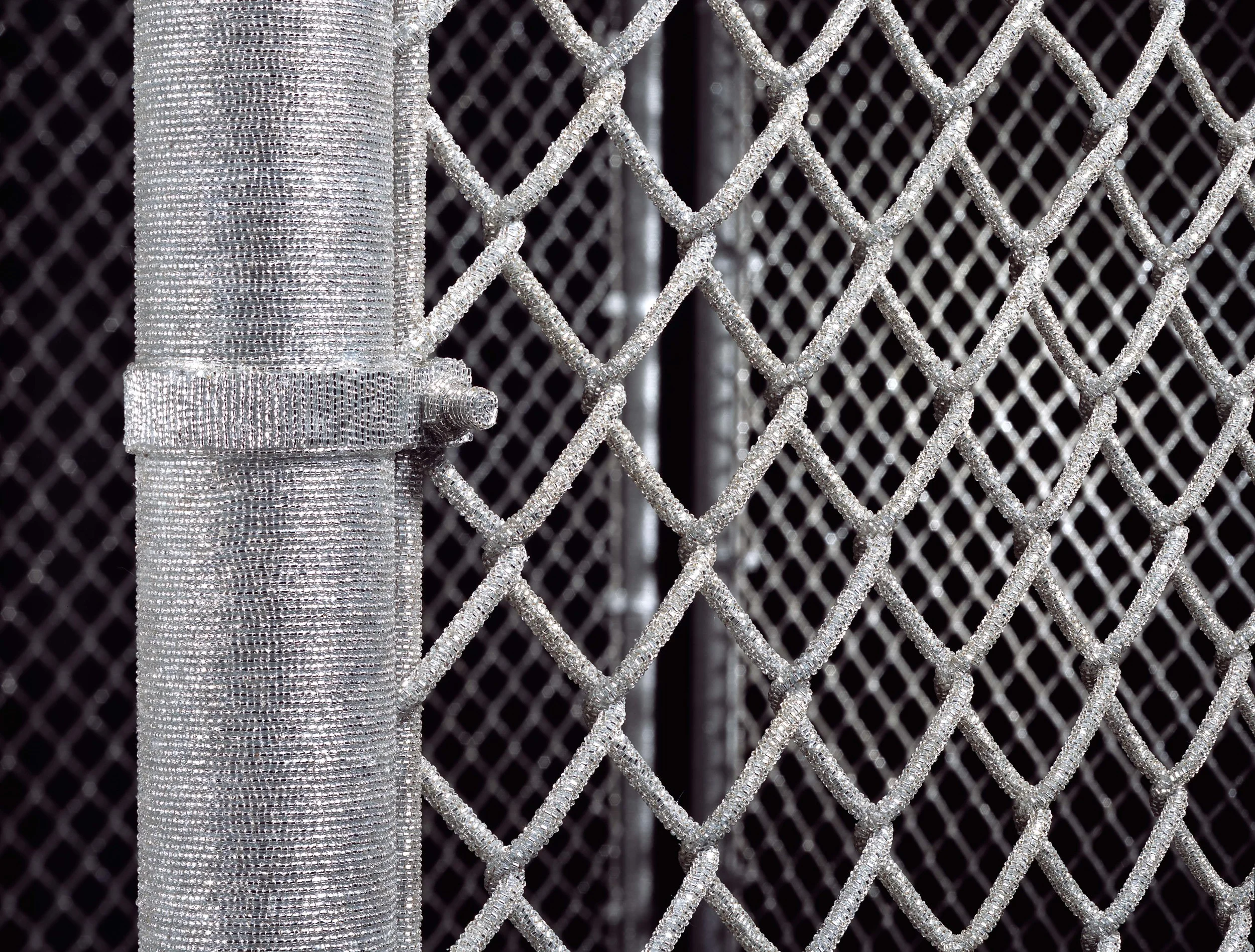 Security Fence, 2005-by Liza Lou, a menacing object clad in silver glass beads