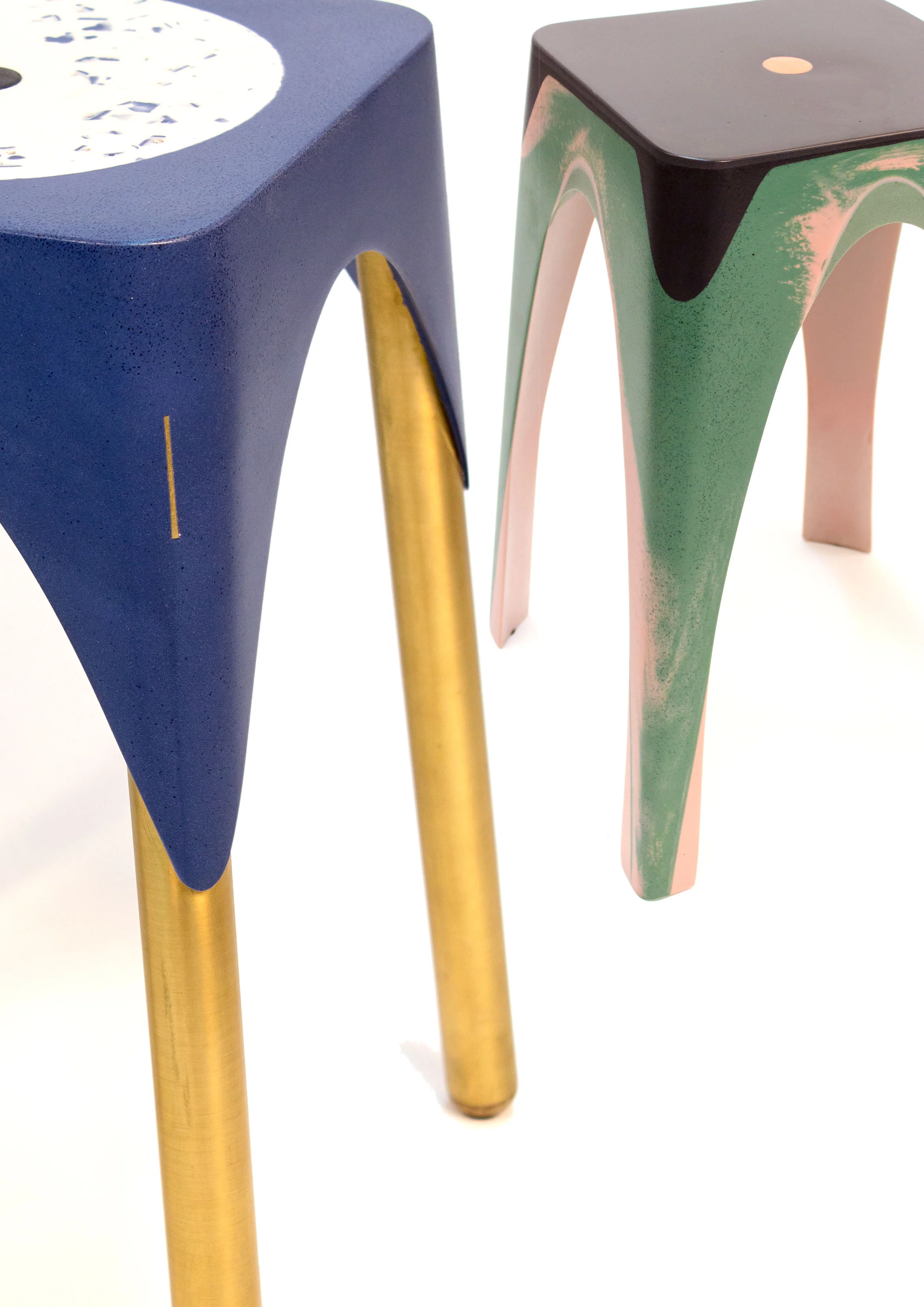 A blend of colors(right) and materials(left), with materials like brass being inserted, for legs, during the casting of the resins.