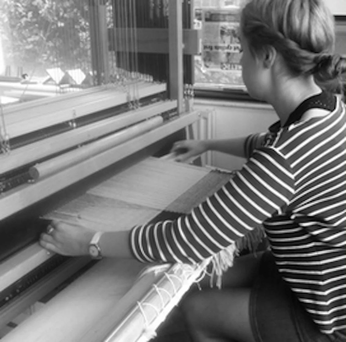 Beatrice samples fabrics and designs at the loom in her London studio