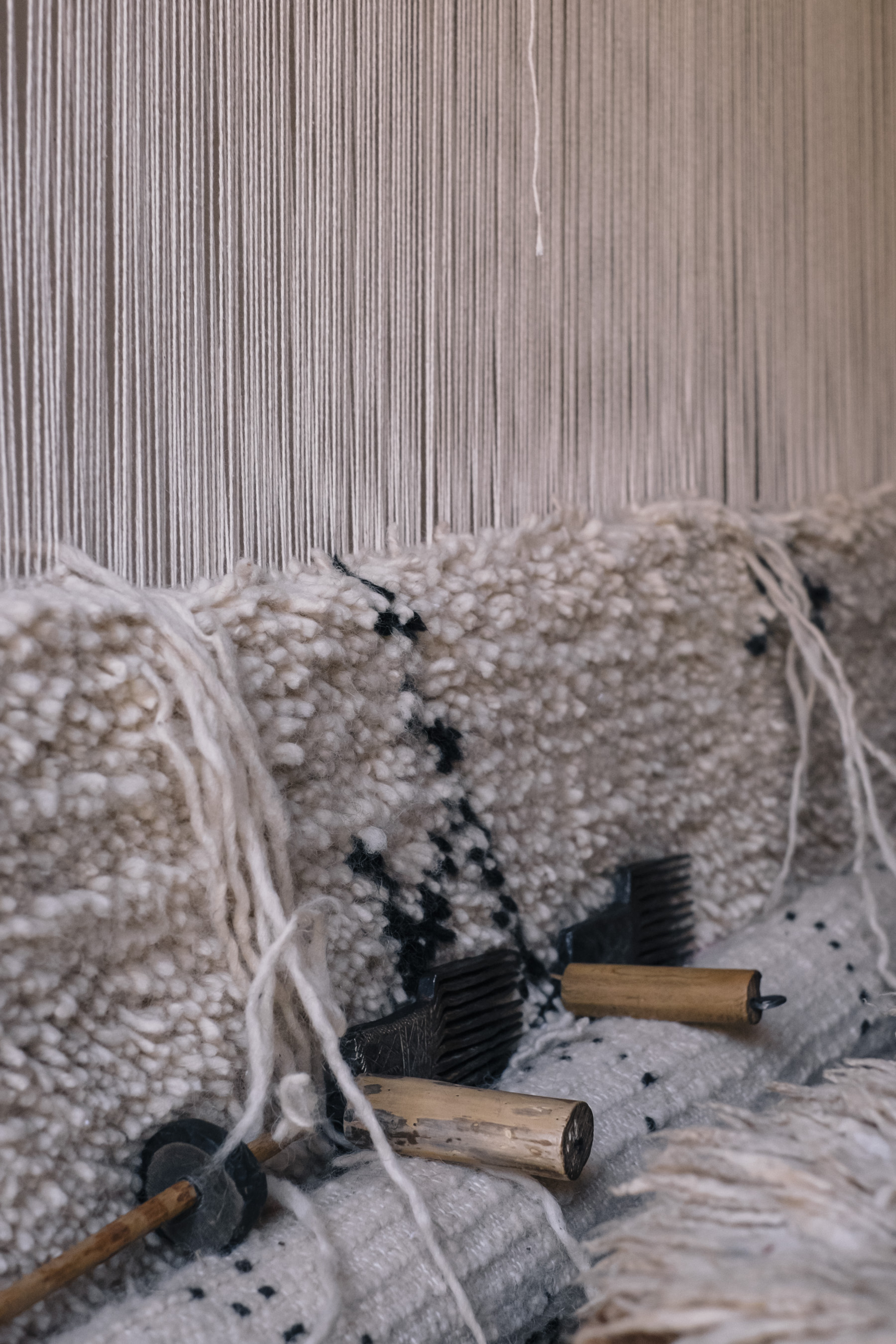 The weaving of traditional Moroccan rugs, with contemporary patterns designed by the artisans, guided by Sabrina Kraus López.
