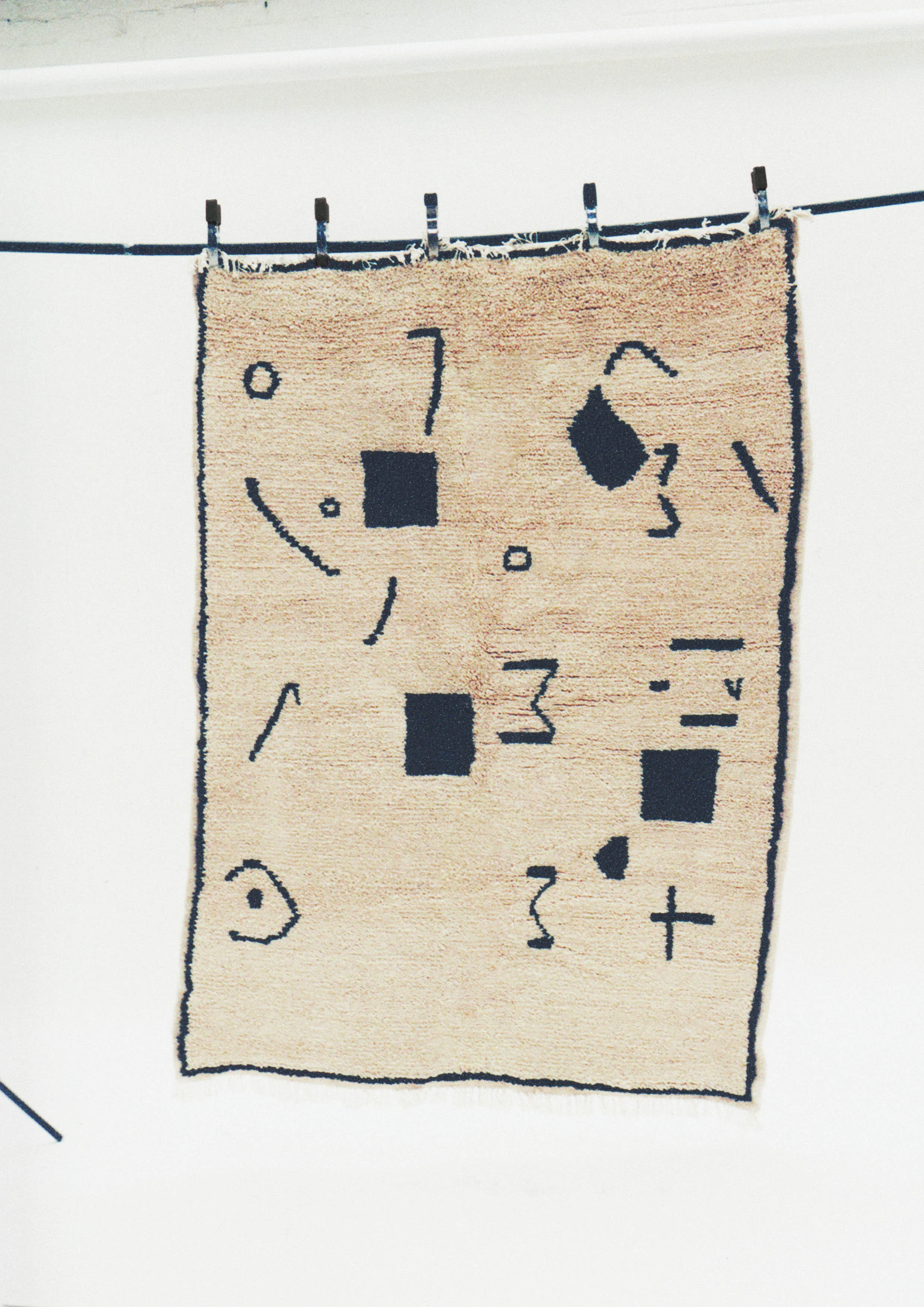 Design exercises conducted by Sabrina, enabled the weavers to create original and contemporary designs, which were transformed into rugs like this one.