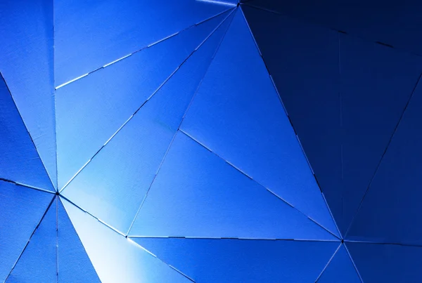 The faceted cardboard structure created for the Adobe Symposium set design by Tobias Horrocks, photography by Barton Taylor.