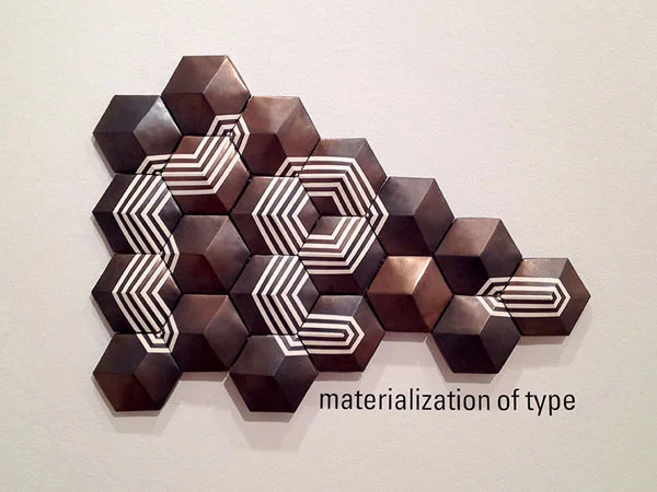 Taekyeom's thesis project, "The rematerialization of type" employed a system of modular, handmade, ceramic forms that helped build letterforms such as this.