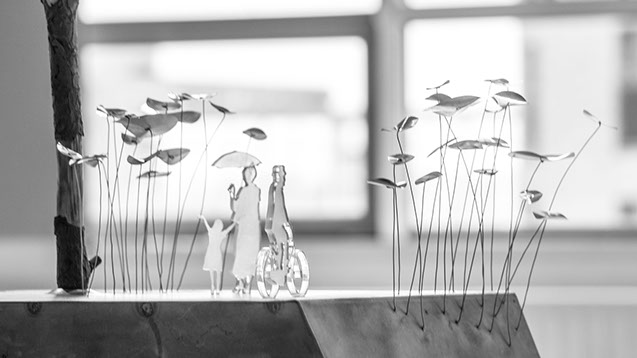 Clusters of slender metal flowers form 'Rain Flower Walk'–a site-specific installation for Veenhuizen, The Netherlands