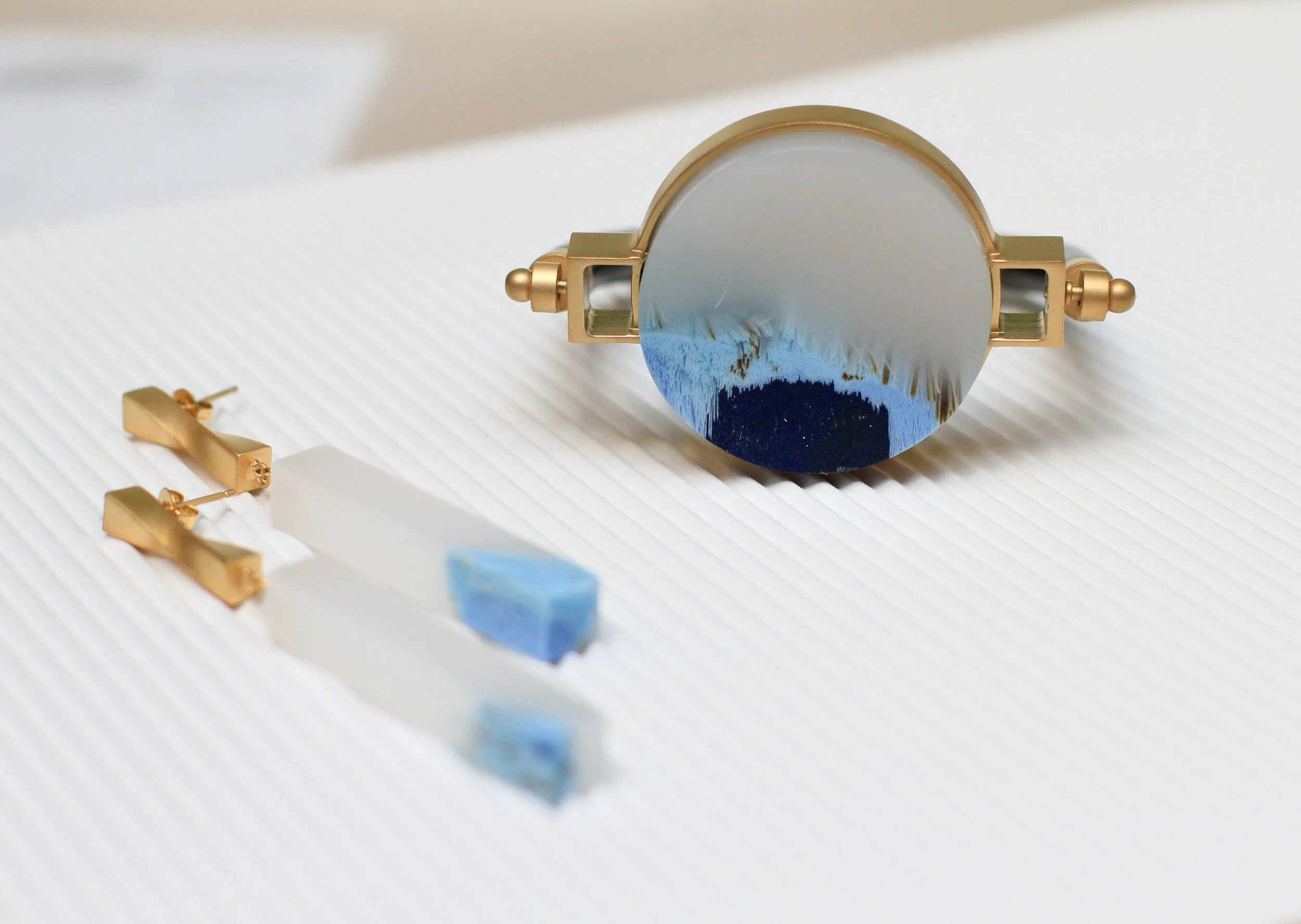 Full Moon Turn-Around Bangle and Full Moon Turn-Around Pillar Earrings by Ejing Zhang
