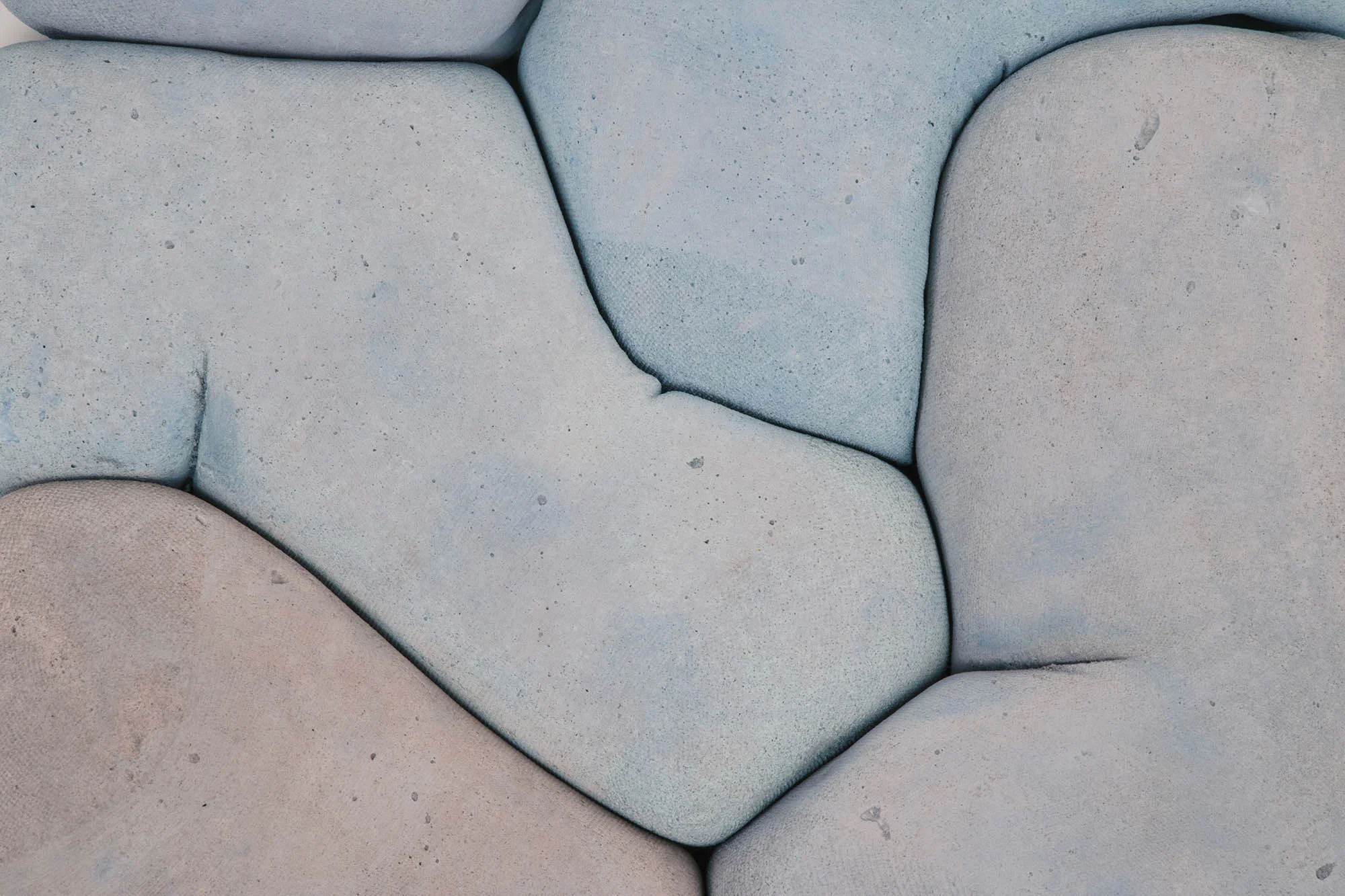 A softer side to the gray, heavy material we know, is unveiled in Iwan Pol's Happy Concrete-II