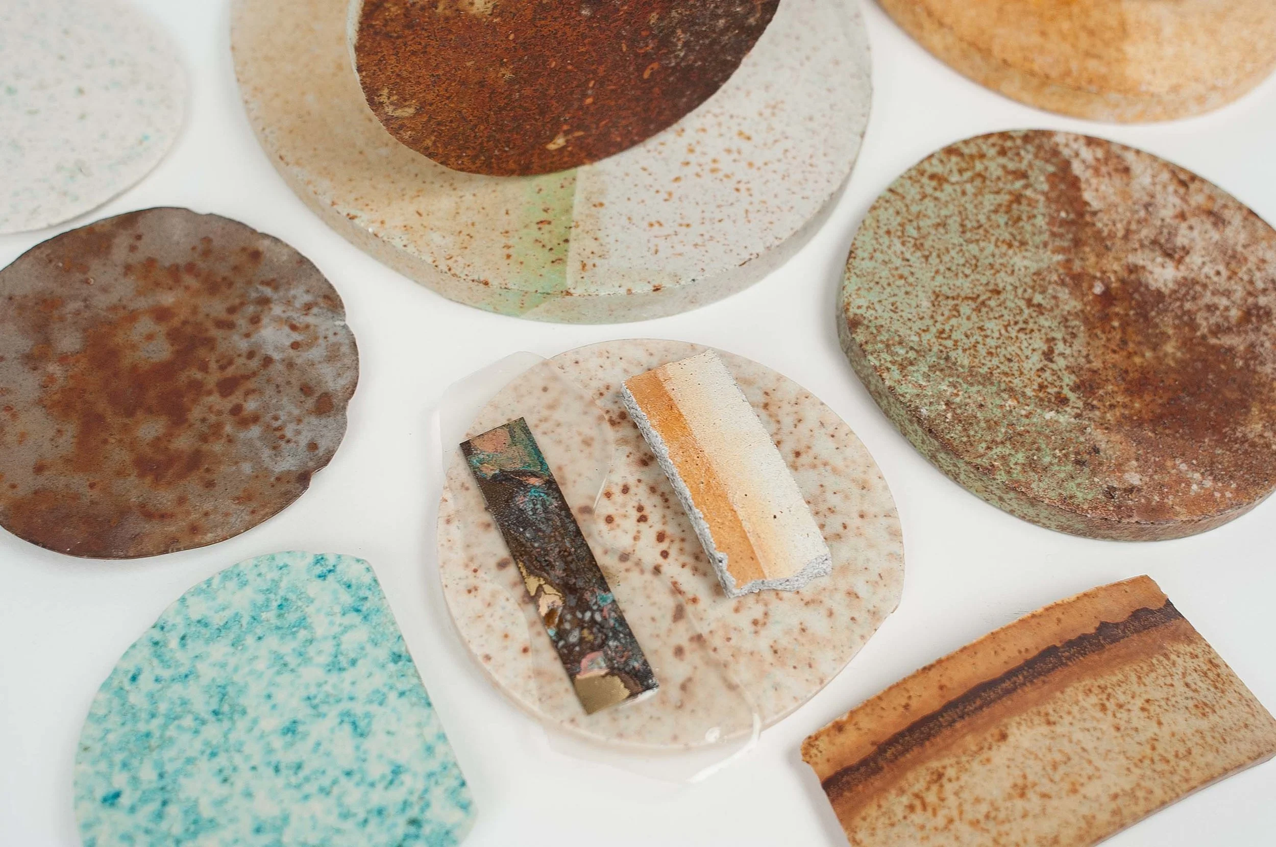 Ariane tested the collected metal dust–a blend of metals such as steel, copper, and brass–and its many variations in an oxidized form for her RUST collection. Seen here, are samples created during the making of this collection.