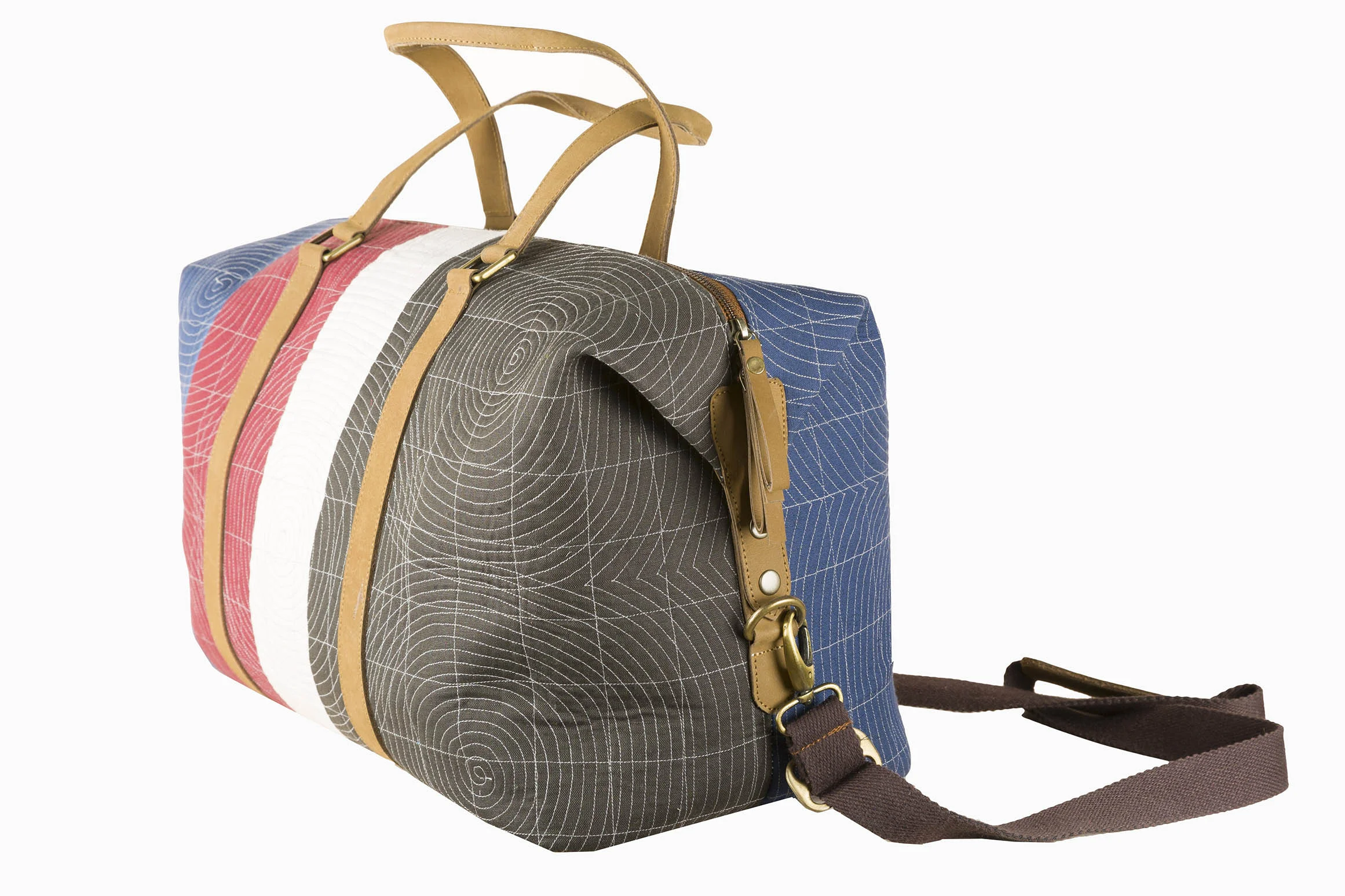 Disparate fabric pieces are quilted together to create robust and elegant pieces like this–A large bag from Doodlage's new accessories collection.