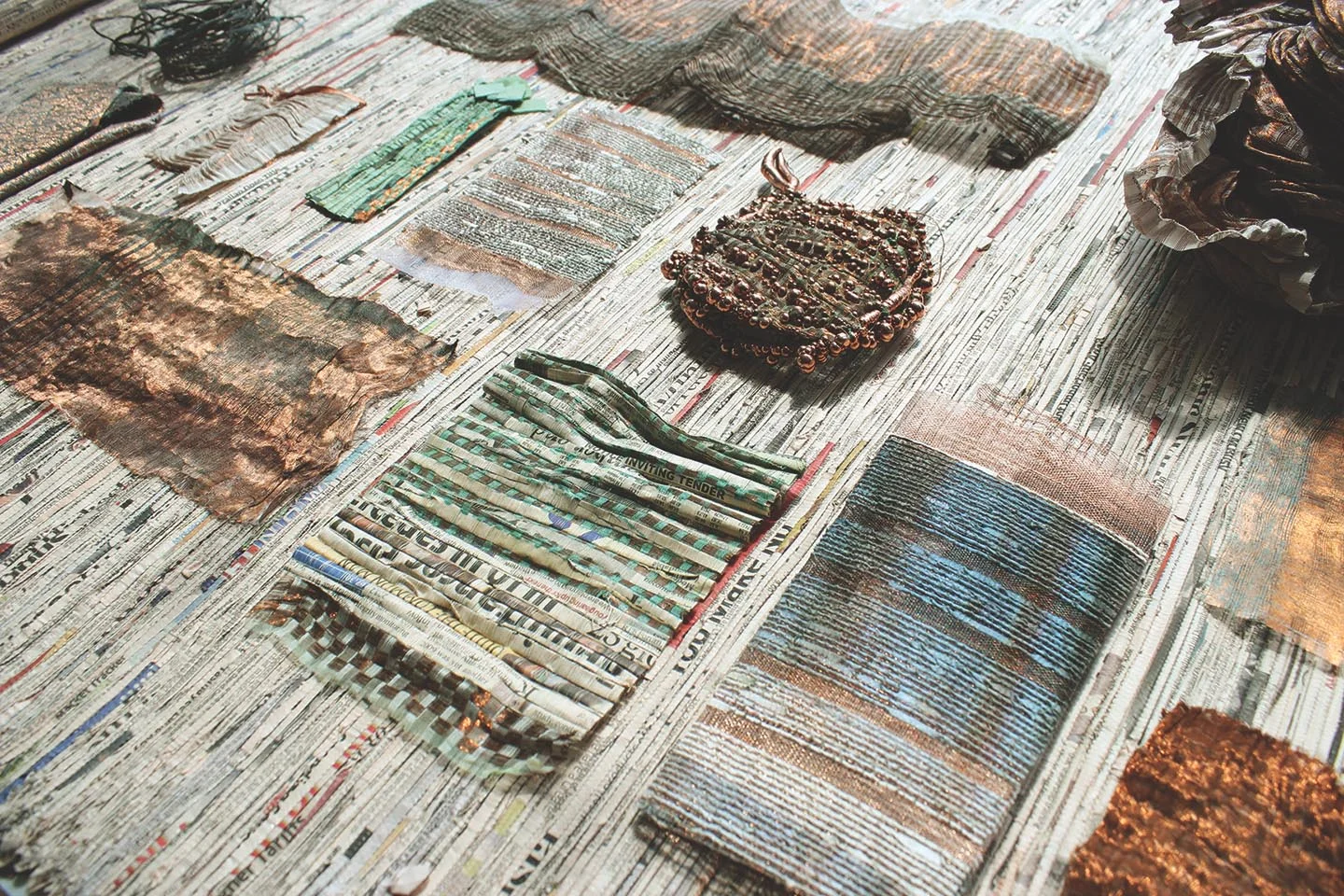 Integrating recycled paper yarn into the weave of copper wire allowed Neha Lad to create a less brittle, and more usable woven material.