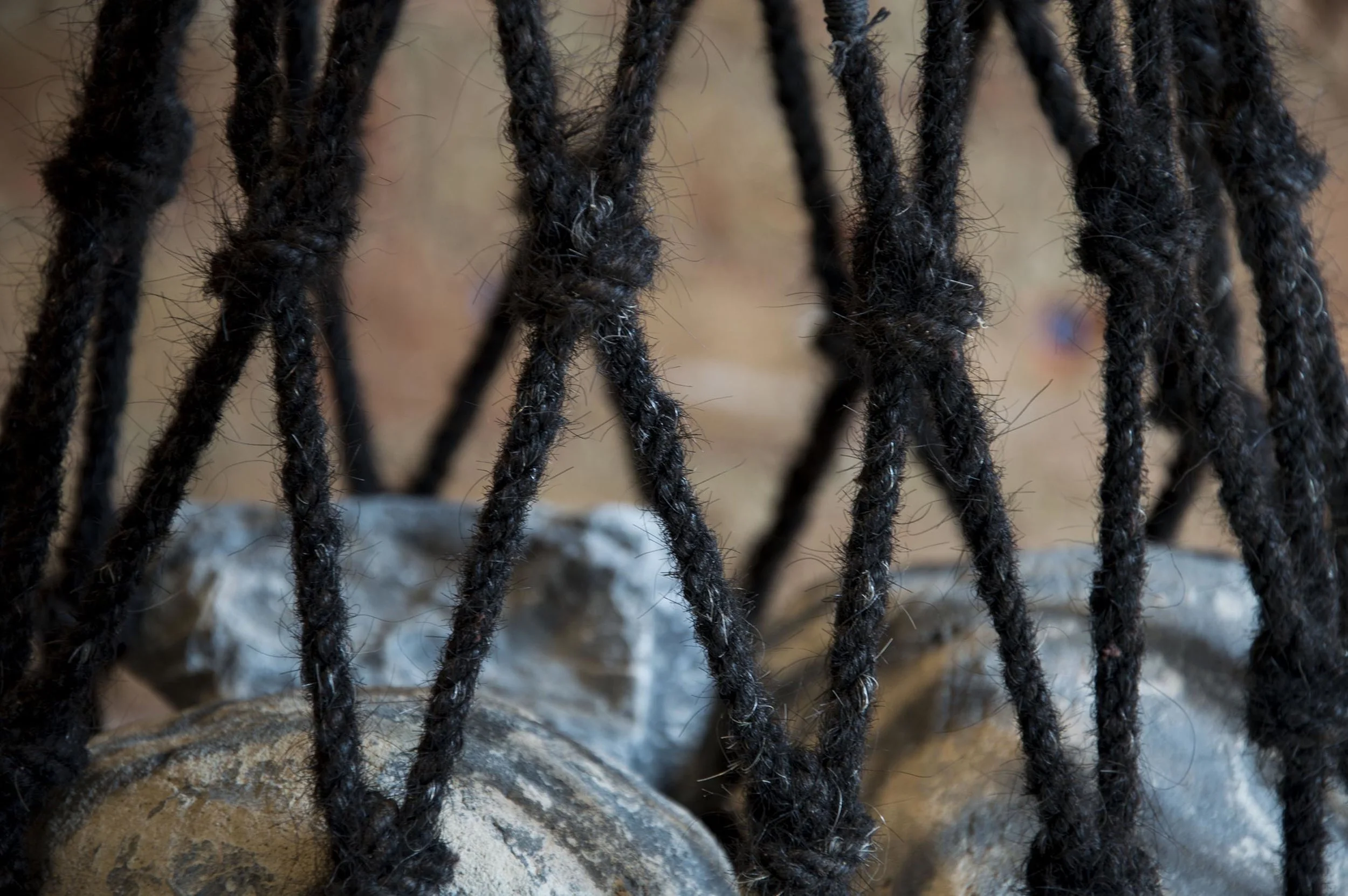 A robust bag, created by Sanne Visser, from ropes of Human hair, as part of her project The New Age of Trichology. Seen here at Dutch Design Week 2016