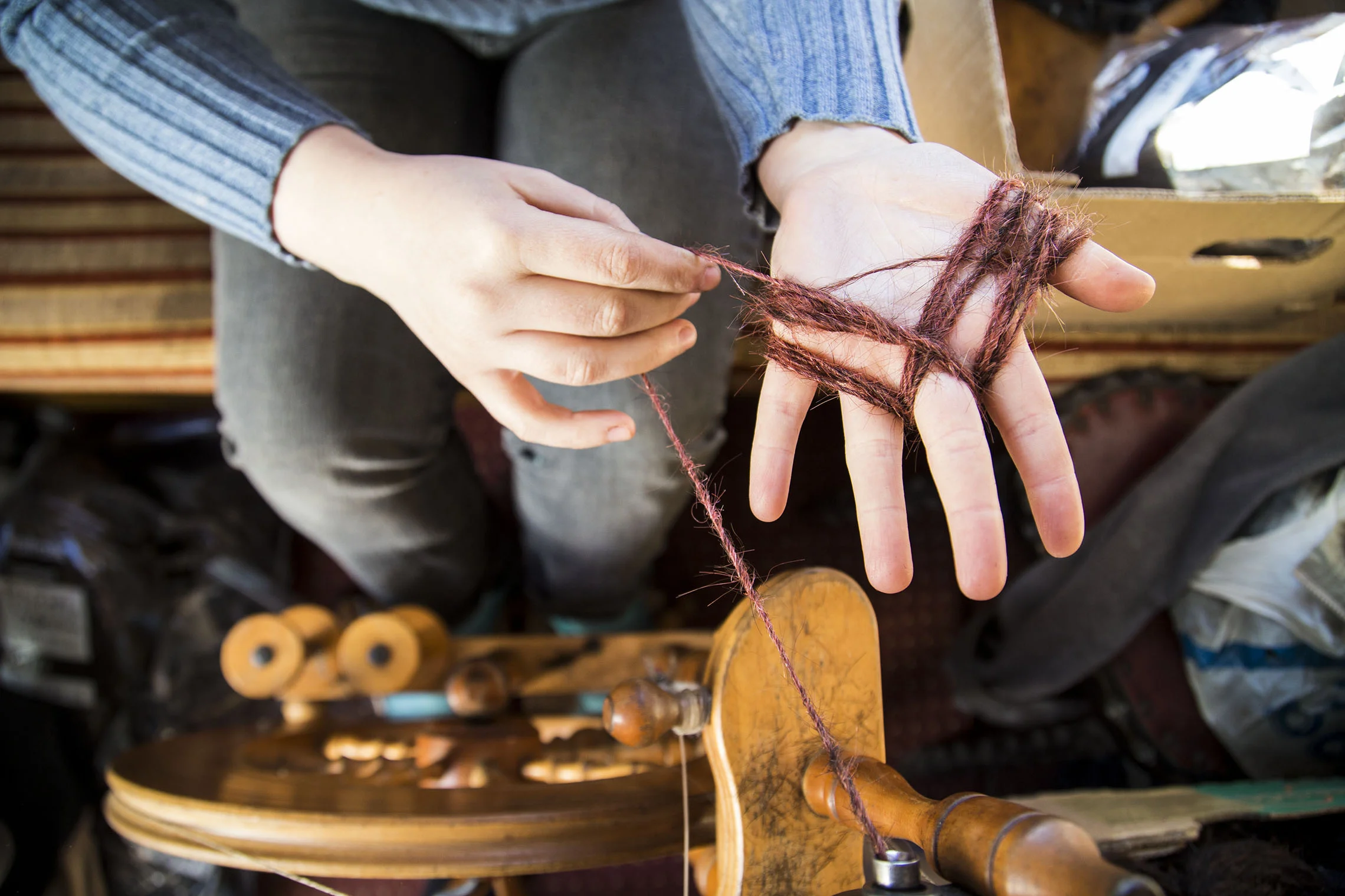 Spinning : The timeless craft process that allowed Sanne Visser to transform human hair waste into usable yarn.