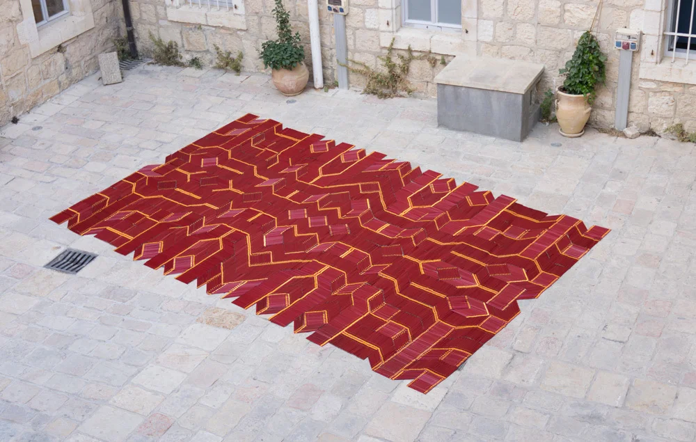Pencil Carpet, by We Make Carpets , was created from 11,000 pencils seen at Jerusalem Design Week 2017