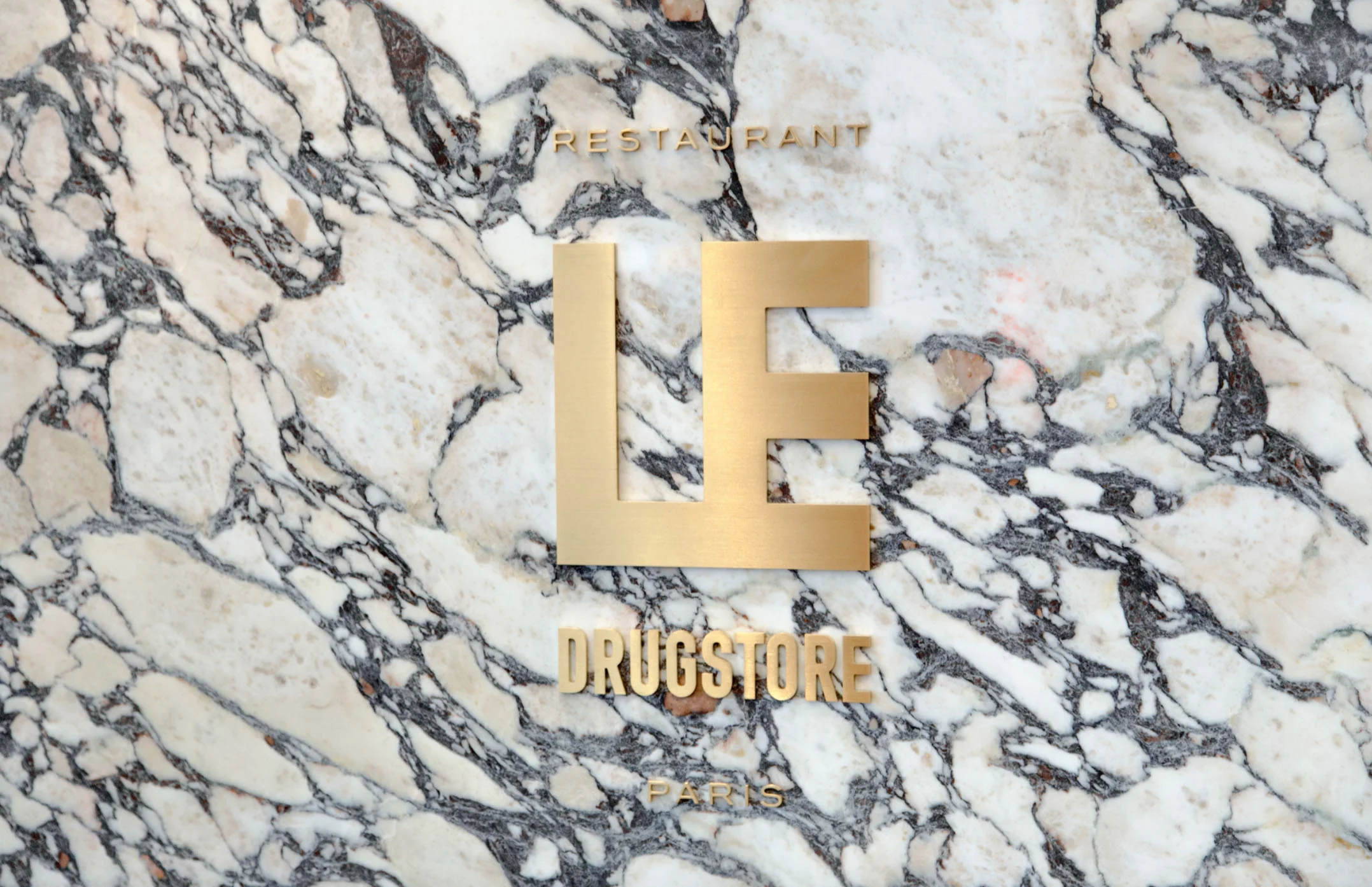 Signage and Brand Identity for Le Drugstore, Paris, by Design&Practice
