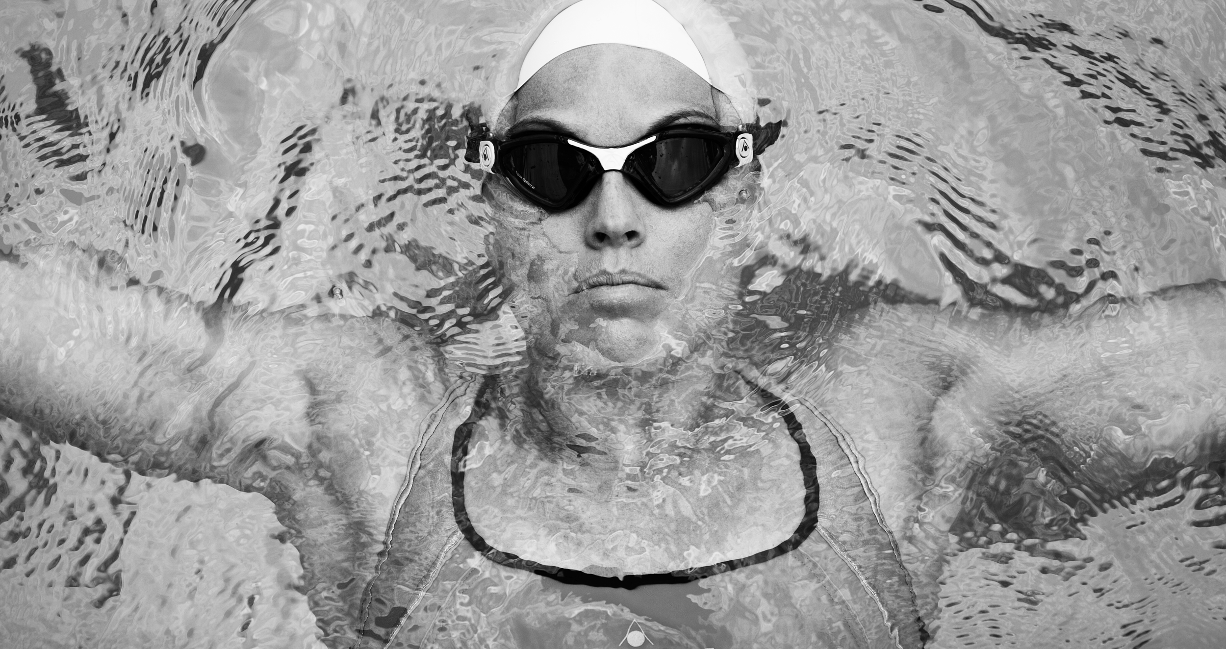 Amanda Beard, seven-time Olympic medalist and former world record–holding swimmer, back-floating in a professional portrait.