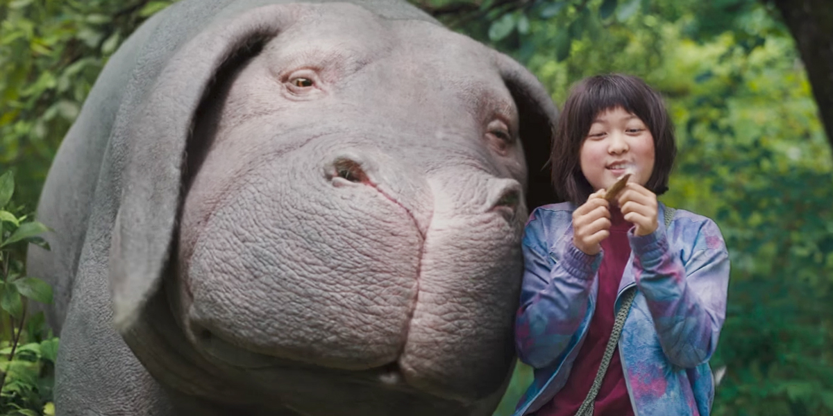 Best friends, Okja and Mija (Seo-Hyeon Ahn, explore the mountains of South Korea in Bong Joon-ho's thought-provoking film Okja .