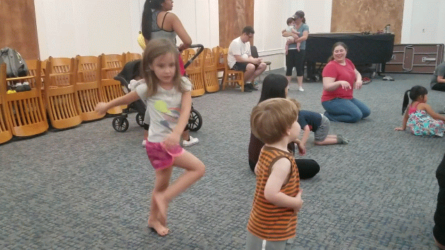 Student improvising during a mixed-age class this summer. In Movers & Makers we take these improvisations deeper by layering more movement concepts and then using choreographic tools to shape them into dances.