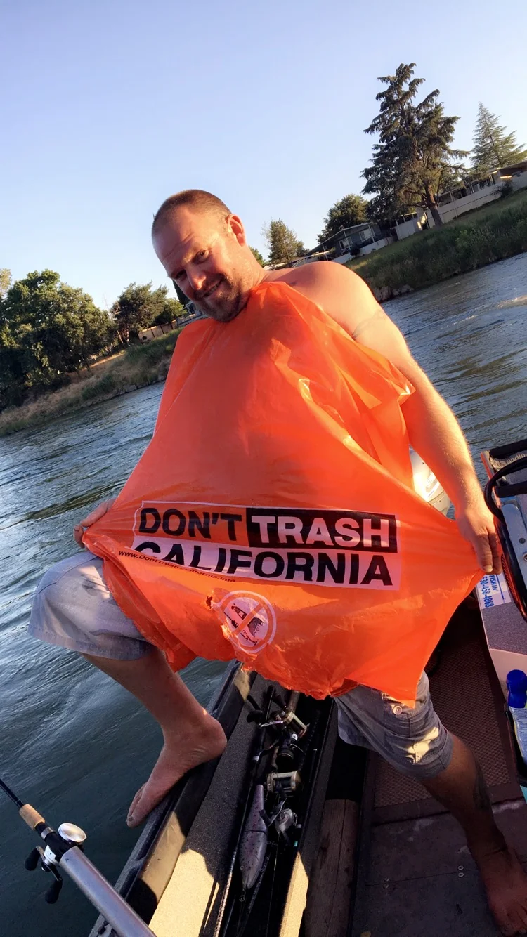 Mike Rasmussen of SalmonSacRiver.com with trash found floating down the Sacramento River