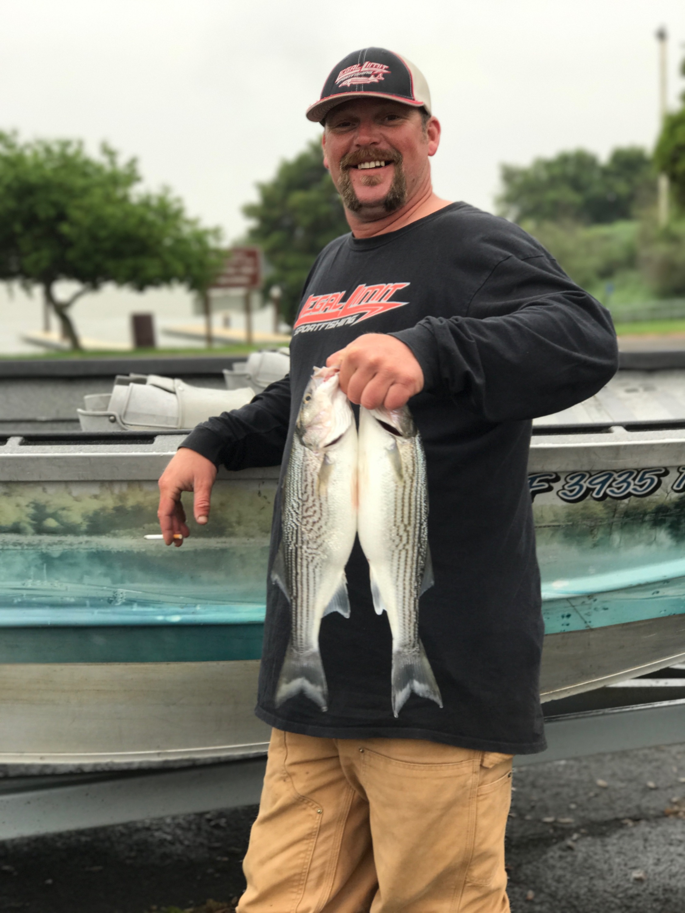 Northern California Fishing Guide Mike Rasmussen Holding A Pair Of Keeper Striped Bass Caught March 23, 2017